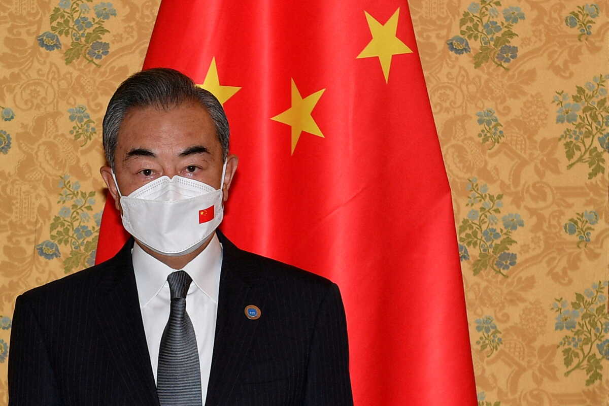 FILE PHOTO: Chinese Foreign Minister Wang Yi poses for a picture prior to meeting U.S. Secretary of State Antony Blinken on the sidelines of the G20 summit in Rome, Italy October 31, 2021. Tiziana Fabi