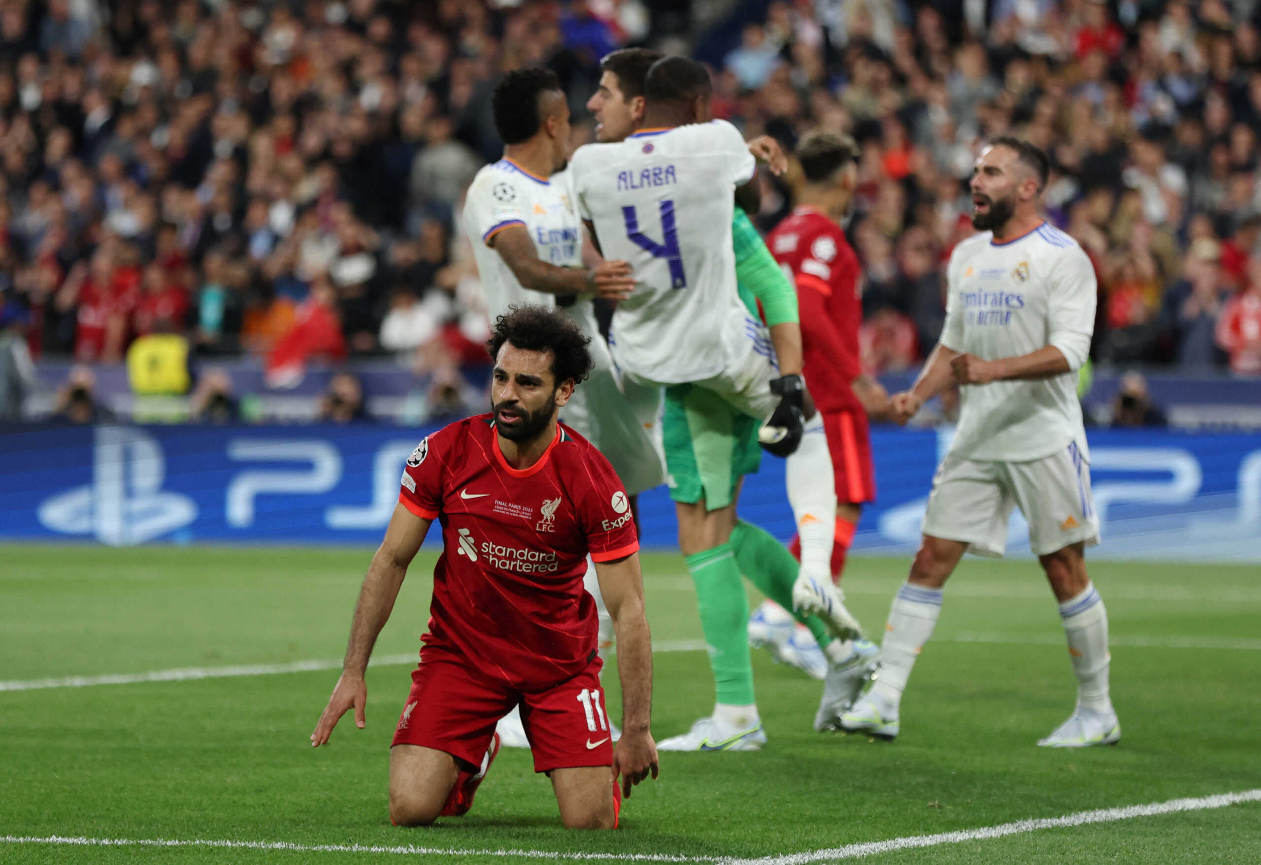 Soccer Football - Champions League Final - Liverpool v Real Madrid - Stade de France, Saint-Denis near Paris, France - May 28, 2022 Liverpool's Mohamed Salah reacts after a missed chance as Real Madrid's Thibaut Courtois and David Alaba react REUTERS