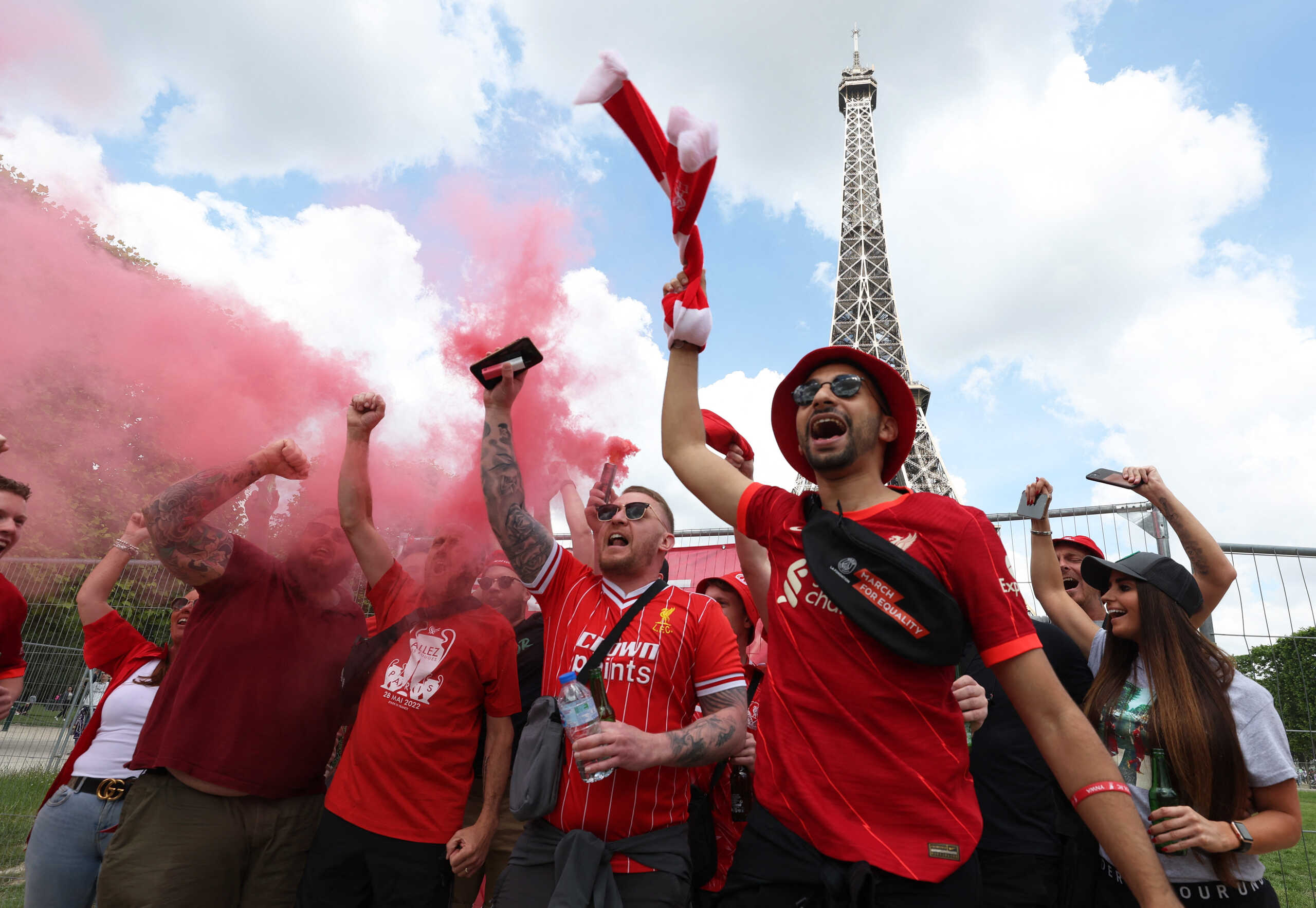 Soccer Football - Champions League - Final - Fans gather in Paris for Liverpool v Real Madrid in the Champions League Final - Paris, France - May 28, 2022 Liverpool fans infront of the Eiffel Tower ahead of the Champions League final REUTERS
