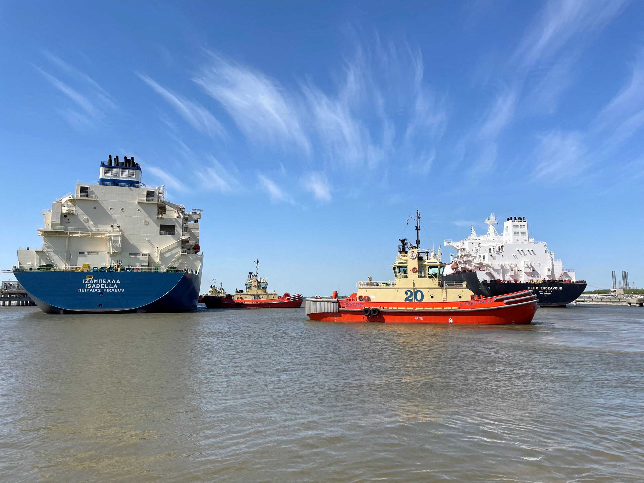 FILE PHOTO: An LNG tanker is guided by tug boats at the Cheniere Sabine Pass LNG export unit in Cameron Parish, Louisiana, U.S., April 14, 2022. REUTERS