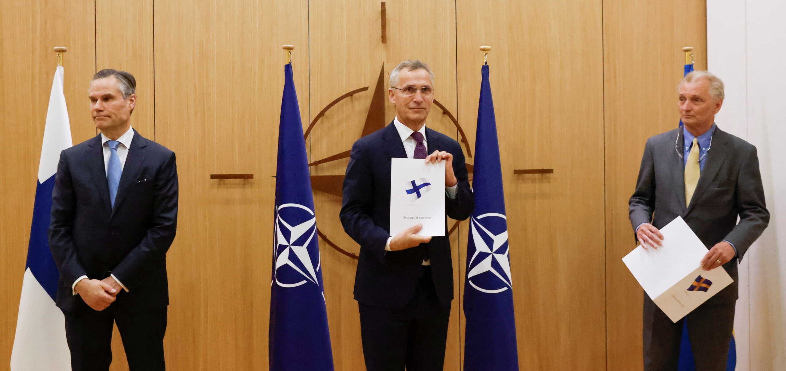 Finland's Ambassador to NATO Klaus Korhonen, NATO Secretary-General Jens Stoltenberg and Sweden's Ambassador to NATO Axel Wernhoff attend a ceremony to mark Sweden's and Finland's application for membership in Brussels, Belgium, May 18, 2022. REUTERS