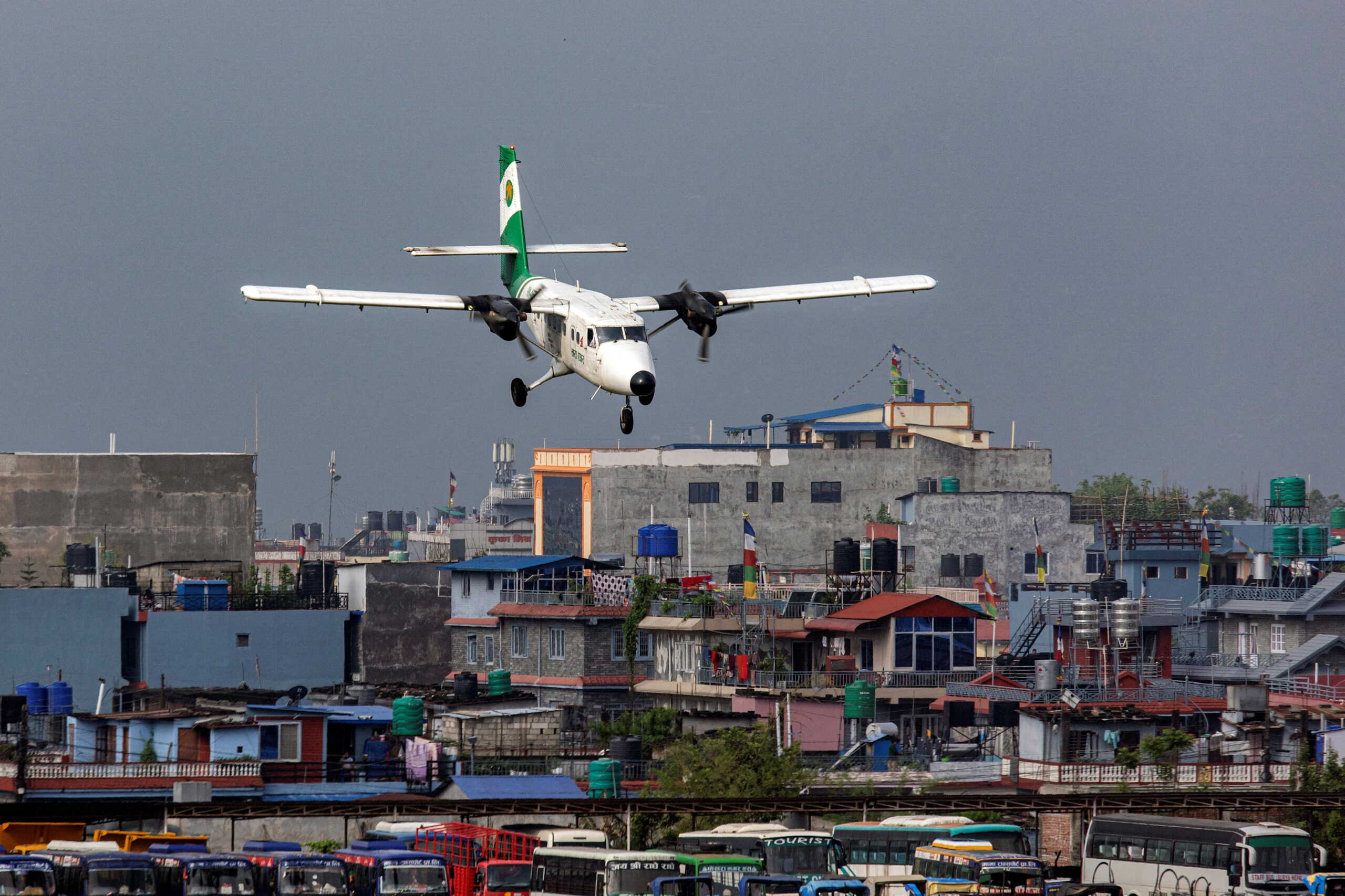 Tara Air's DHC-6 Twin Otter, tail number 9N-AET prepares to land at the airport of Pokhara, Nepal, April 11, 2022. Picture taken April 11, 2022. REUTERS