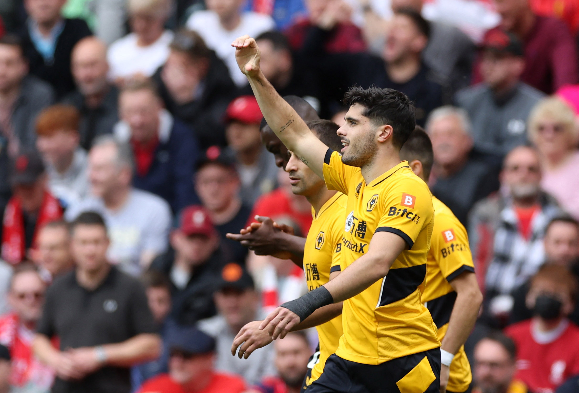 Soccer Football - Premier League - Liverpool v Wolverhampton Wanderers - Anfield, Liverpool, Britain - May 22, 2022 Wolverhampton Wanderers' Pedro Neto celebrates scoring their first goal with teammates REUTERS