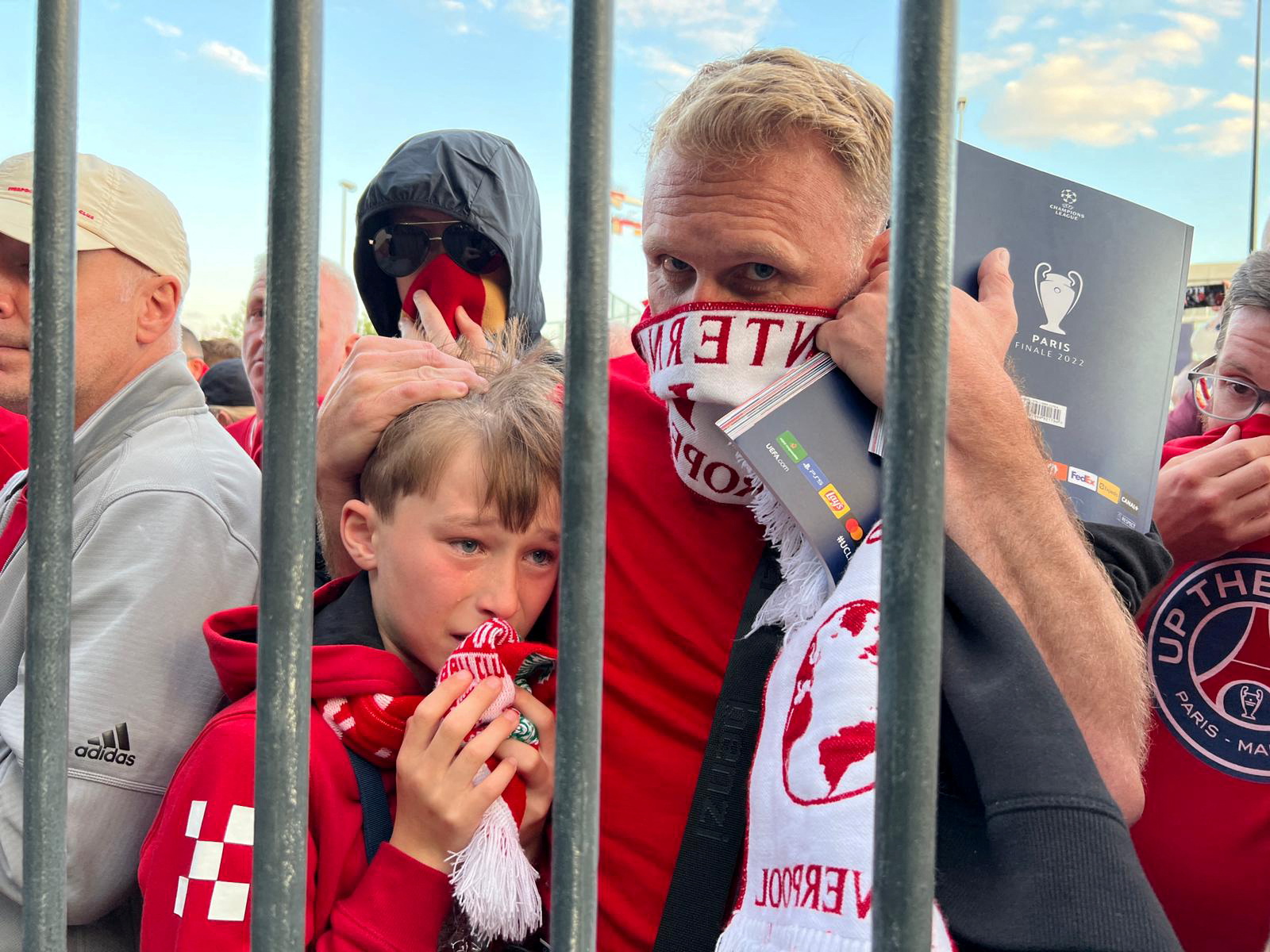 Soccer Football - Champions League Final - Liverpool v Real Madrid - Stade de France, Saint-Denis near Paris, France - May 28, 2022 Liverpool fans react as they queue to access Stade de France before Champions League Final   REUTERS