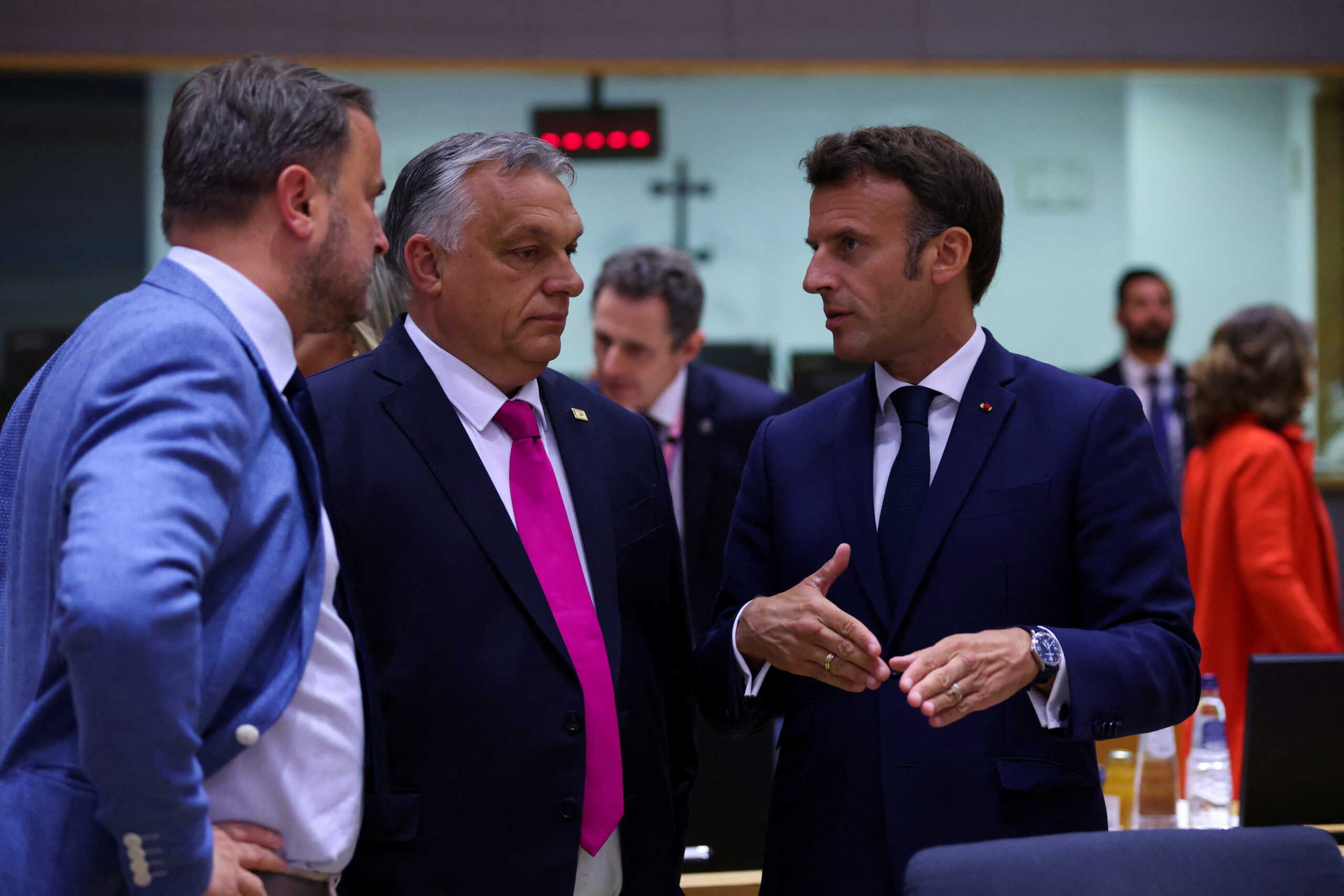 Hungary's Prime Minister Viktor Orban and France's President Emmanuel Macron attend the European Union leaders summit, as EU's leaders attempt to agree on Russian oil sanctions in response to Russia's invasion of Ukraine, in Brussels, Belgium May 30, 2022. REUTERS
