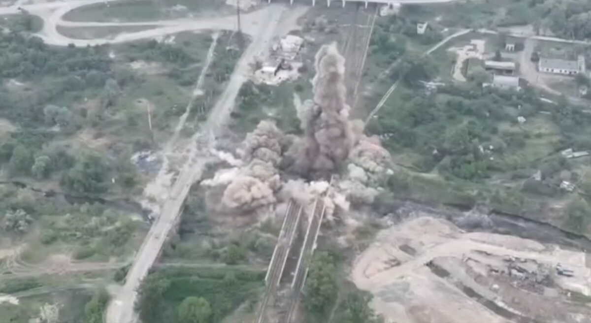 View of an explosion after a joint operation of members of the National Guard of Ukraine, Special Operations Forces and State Security Service to blow up a bridge connecting Sievierodonetsk and Lysychansk to Rubizhne, amid Russia's invasion of Ukraine, in Sievierodonetsk, Luhansk region, Ukraine in this screengrab taken from a handout video released May 18, 2022. Ukraine National Guard