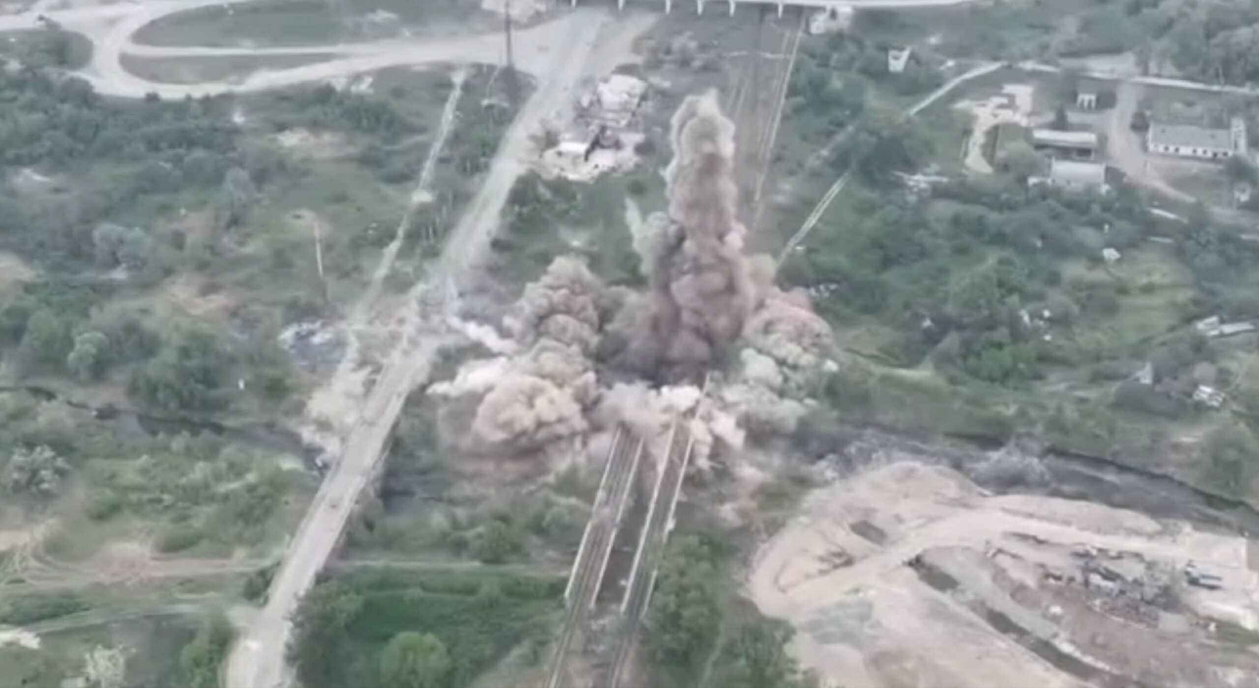 View of an explosion after a joint operation of members of the National Guard of Ukraine, Special Operations Forces and State Security Service to blow up a bridge connecting Sievierodonetsk and Lysychansk to Rubizhne, amid Russia's invasion of Ukraine, in Sievierodonetsk, Luhansk region, Ukraine in this screengrab taken from a handout video released May 18, 2022. Ukraine National Guard