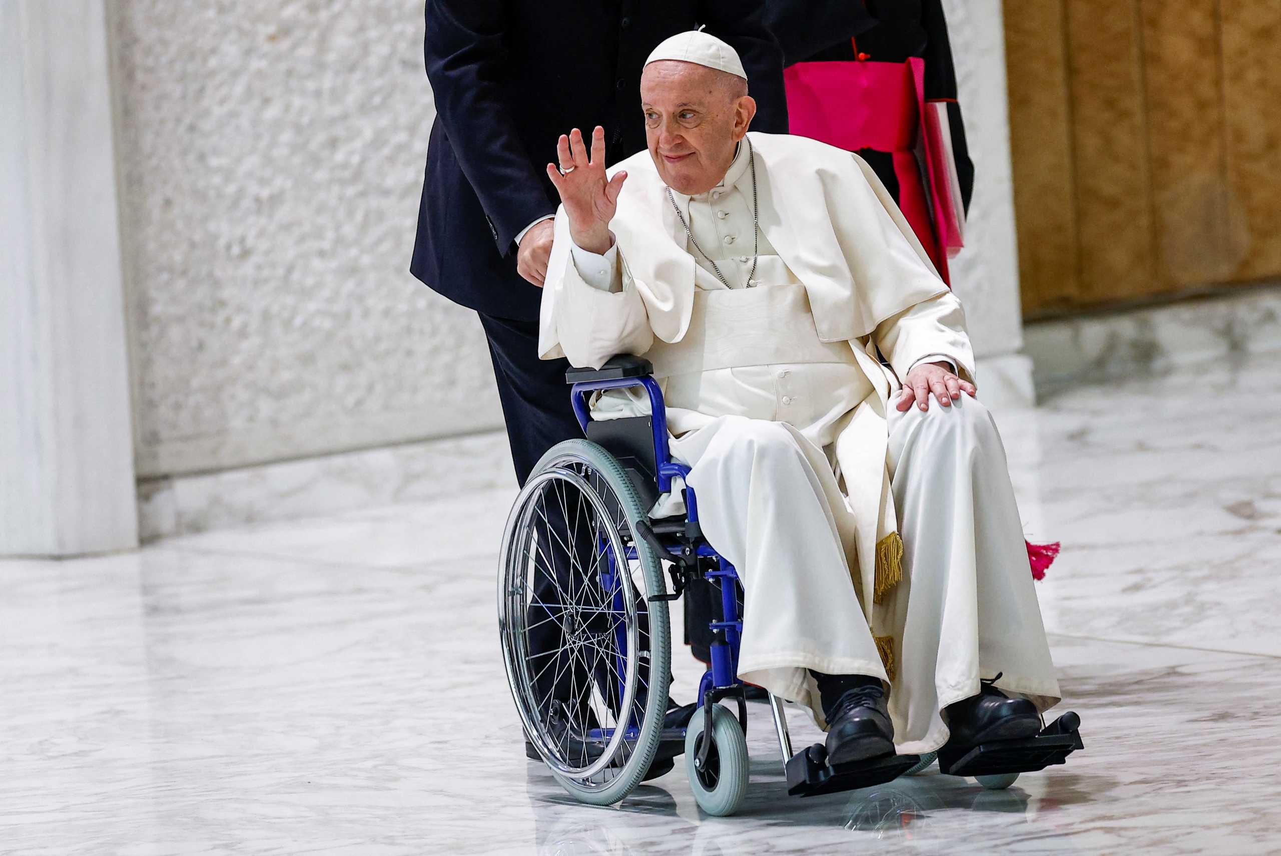 Pope Francis arrives on a wheelchair to meet with participants in the plenary assembly of the International Union of Superiors General (IUSG) at the Vatican, May 5, 2022. REUTERS