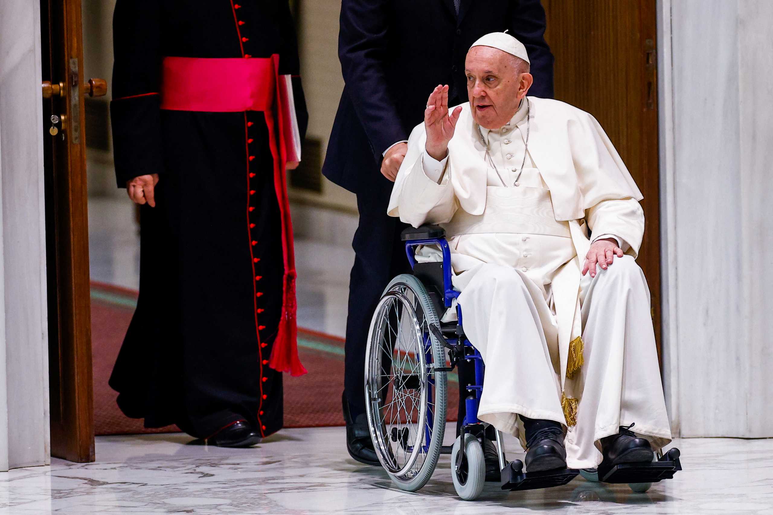 Pope Francis arrives on a wheelchair to meet with participants in the plenary assembly of the International Union of Superiors General (IUSG) at the Vatican, May 5, 2022. REUTERS