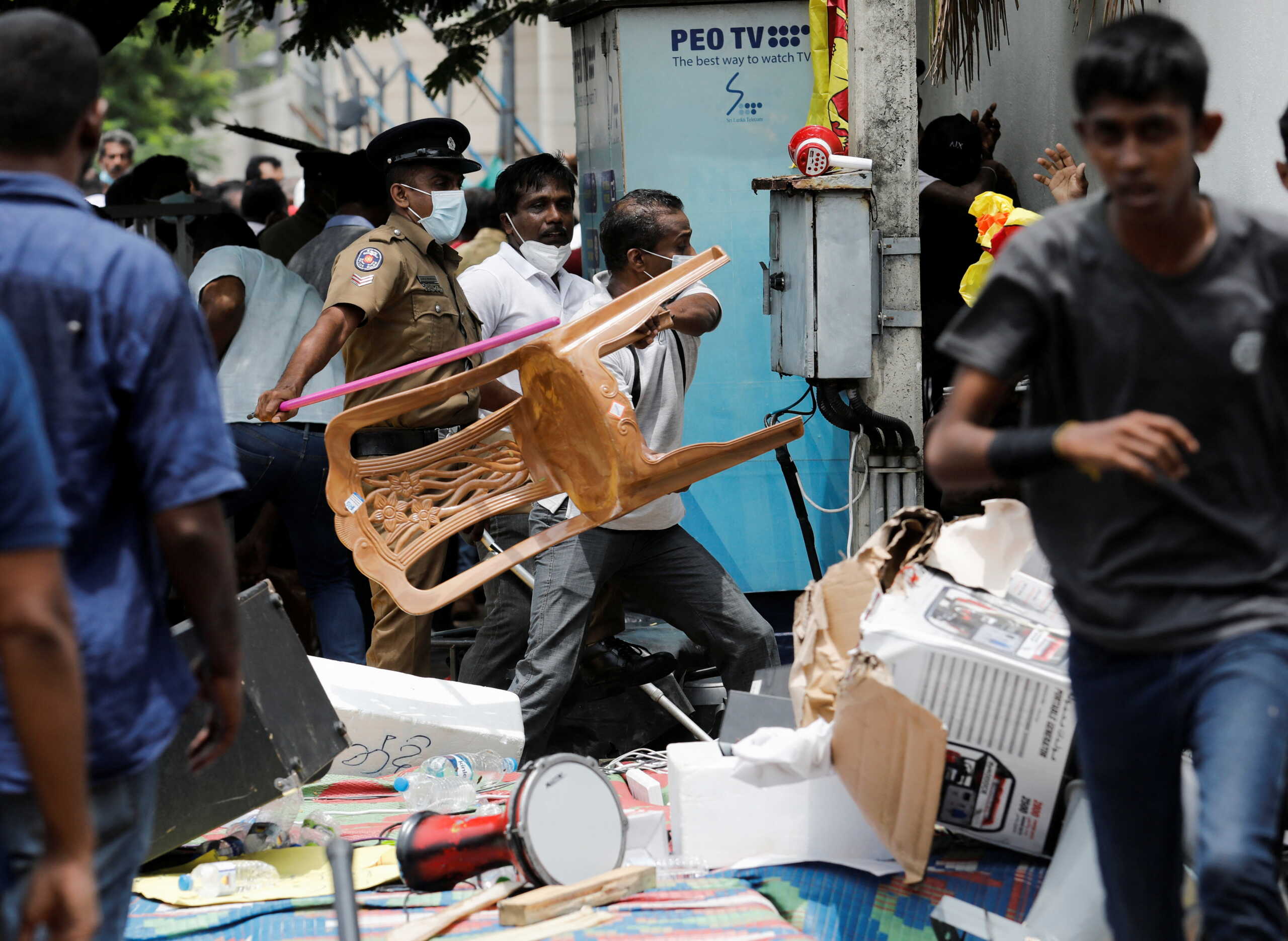 Supporters of Sri Lanka's ruling party destroy tents belonging to anti-government demonstrators, during a clash between the two groups, in front of the Prime Minister's official residence, amid the country's economic crisis, in Colombo, Sri Lanka, May 9, 2022. REUTERS