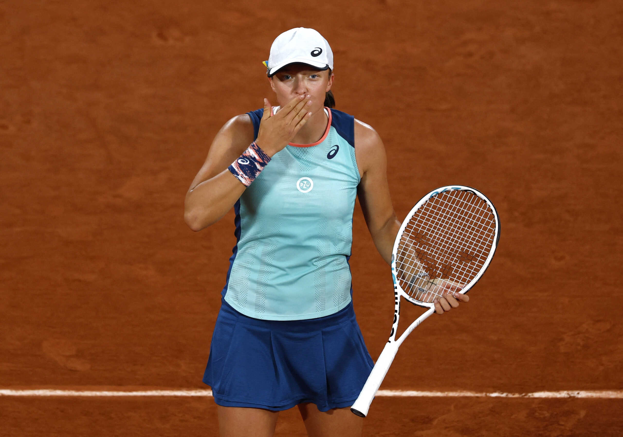 Tennis - French Open - Roland Garros, Paris, France - May 23, 2022 Poland's Iga Swiatek celebrates winning her first round match against Ukraine's Lesia Tsurenko REUTERS
