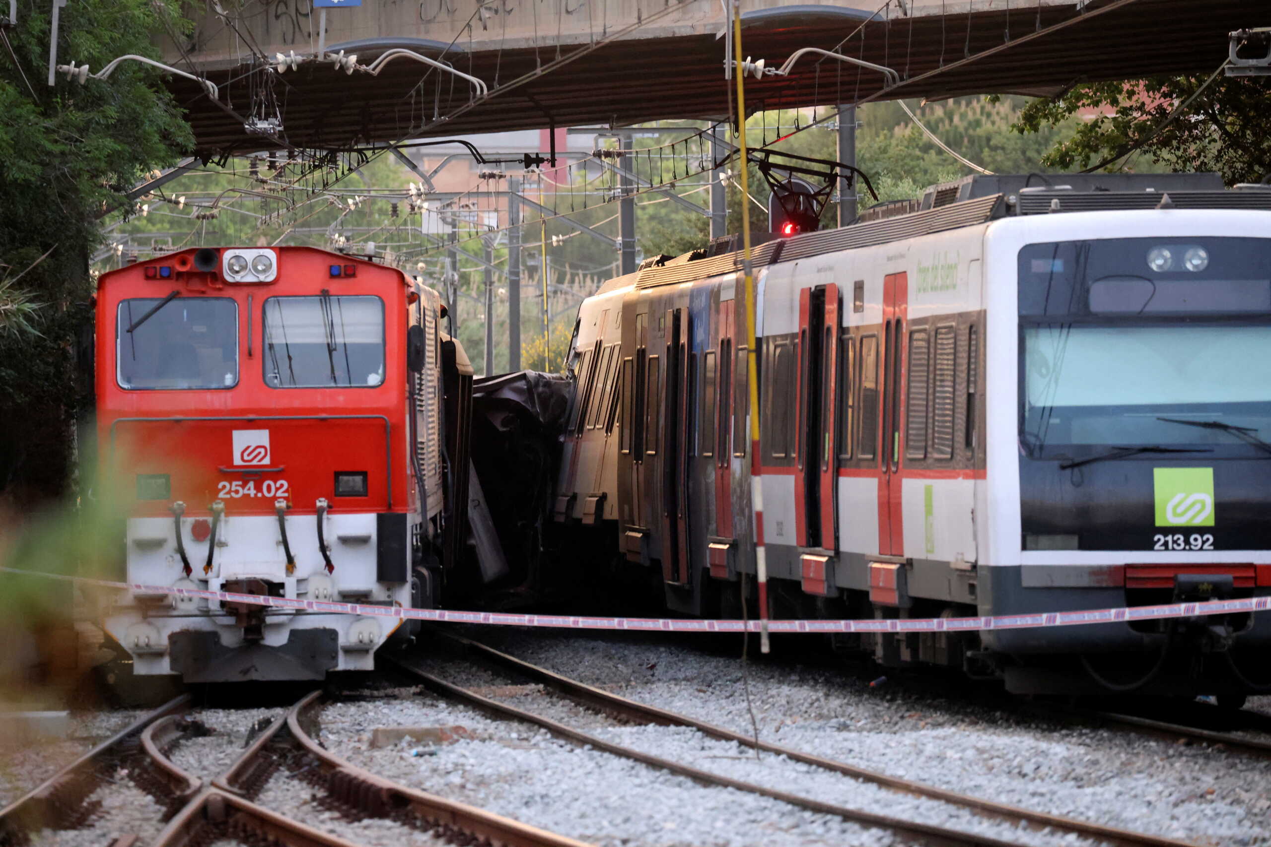 A commuter train and a goods train are pictured after they collided, on the outskirts of Barcelona, Spain May 16, 2022. REUTERS
