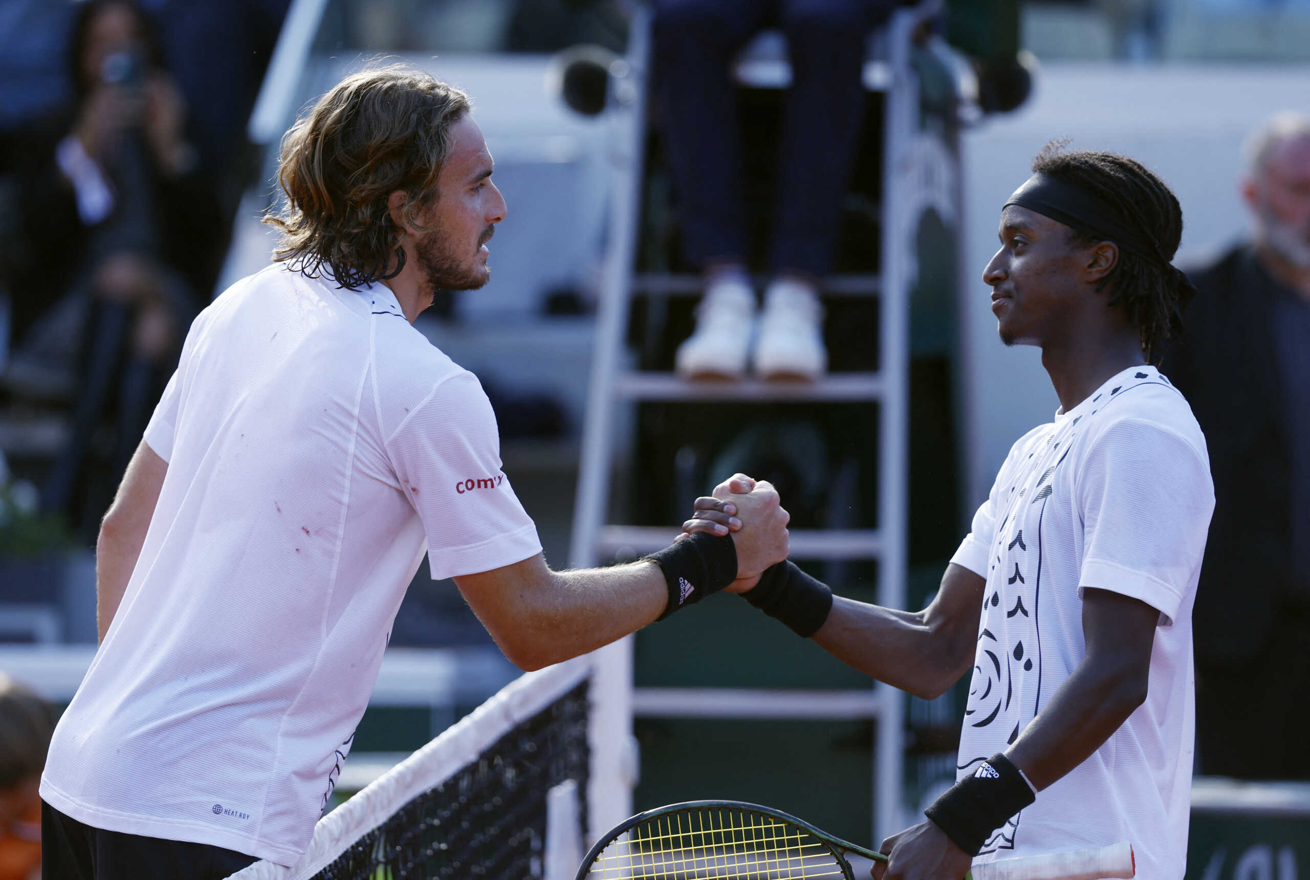 Tennis - French Open - Roland Garros, Paris, France - May 28, 2022 Greece's Stefanos Tsitsipas shakes hands with Sweden's Mikael Ymer after winning their third round match REUTERS