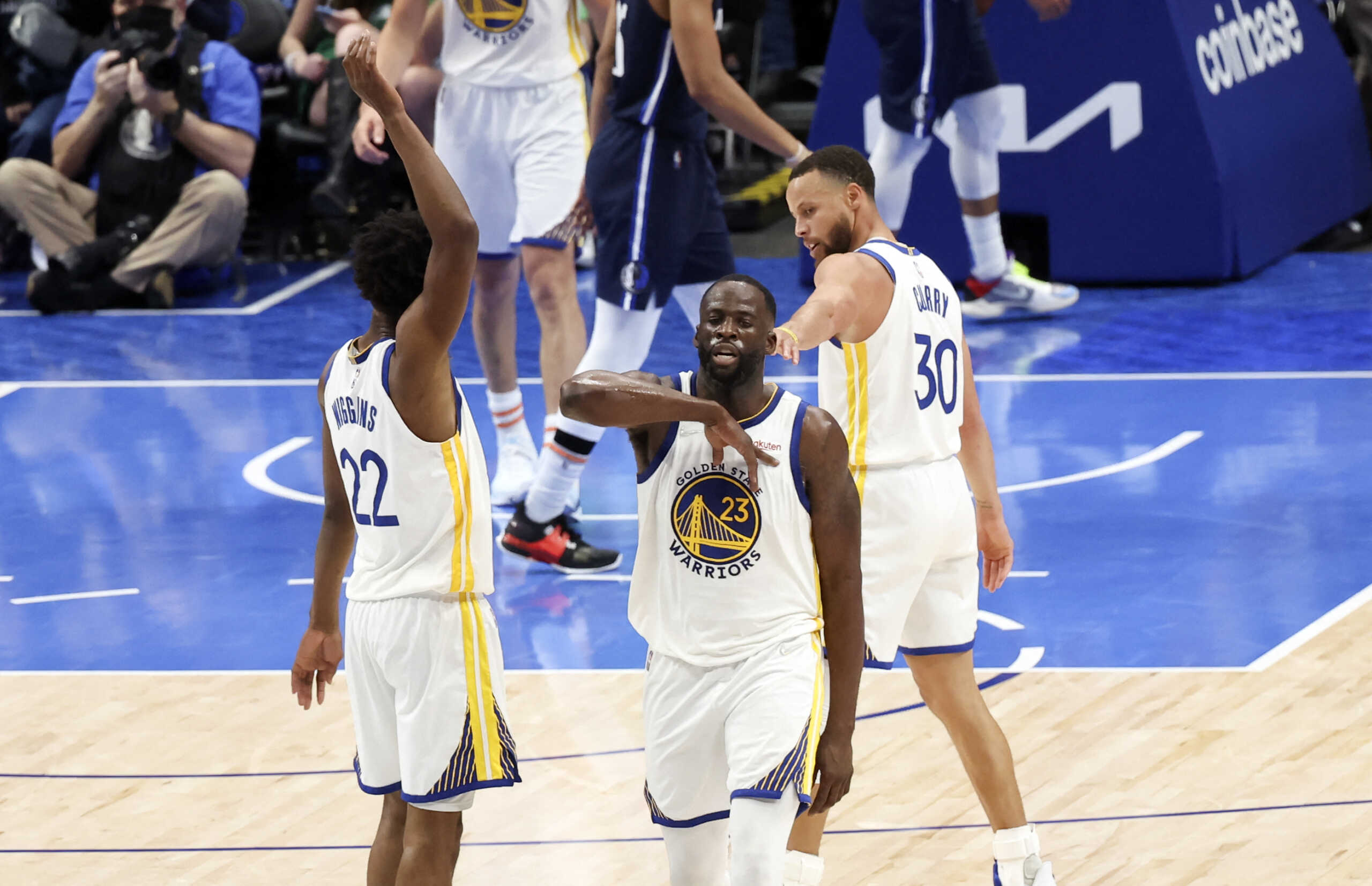May 22, 2022; Dallas, Texas, USA; Golden State Warriors forward Andrew Wiggins (22) and Golden State Warriors forward Draymond Green (23) and Golden State Warriors guard Stephen Curry (30) during the second half against the Dallas Mavericks in game three of the 2022 Western Conference finals at American Airlines Center. Mandatory Credit: Kevin Jairaj-USA TODAY Sports