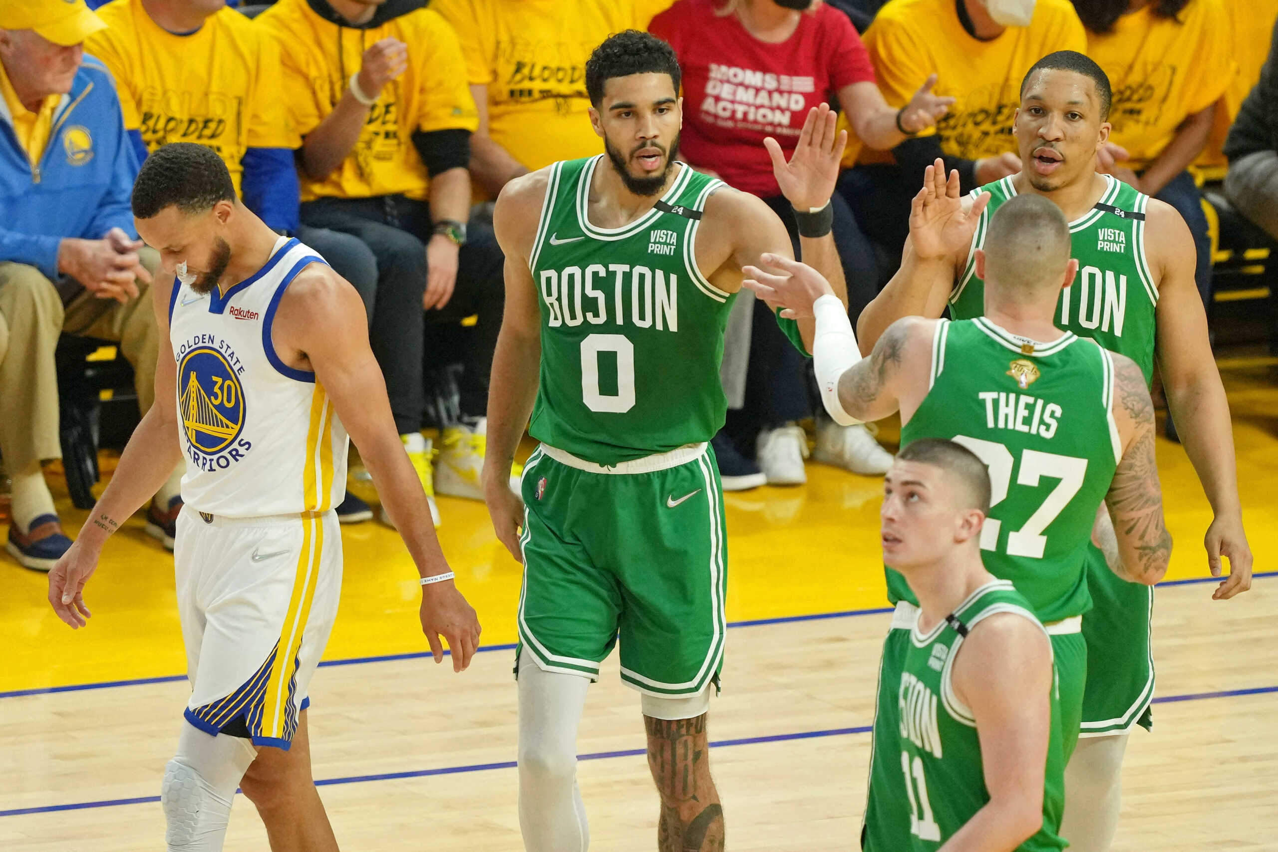 Jun 2, 2022; San Francisco, California, USA; Boston Celtics forward Jayson Tatum (0) high fives Boston Celtics center Daniel Theis (27) after a play against the Golden State Warriors during the first half of game one of the 2022 NBA Finals at Chase Center. Mandatory Credit: Darren Yamashita-USA TODAY Sports