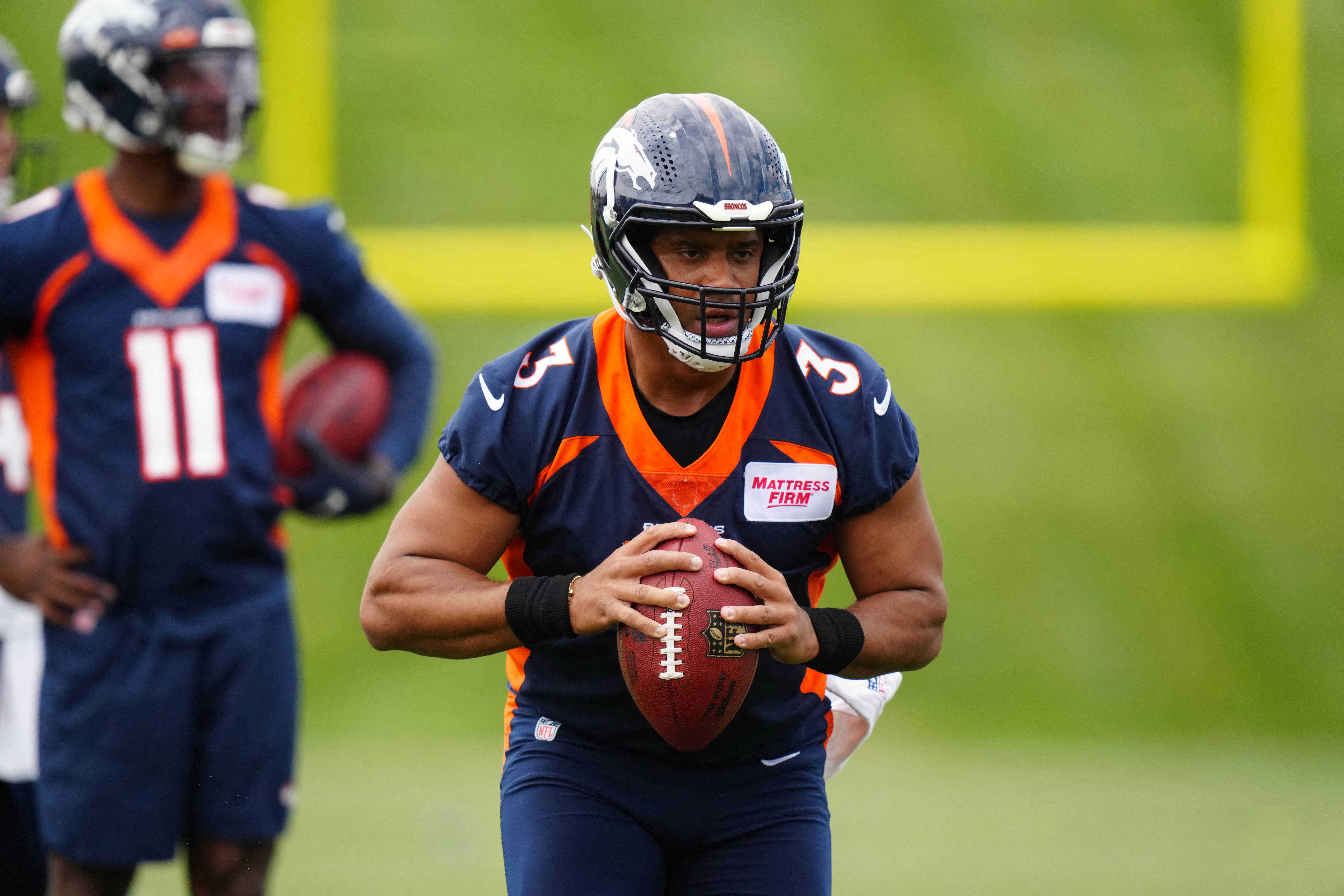 May 23, 2022; Englewood, CO, USA; Denver Broncos quarterback Russell Wilson (3) during OTA workouts at the UC Health Training Center. Mandatory Credit: Ron Chenoy-USA TODAY Sports