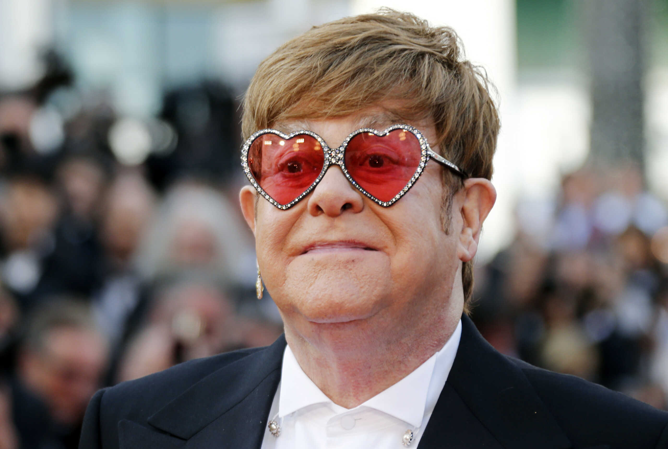 72nd Cannes Film Festival - Screening of the film "Rocketman" out of competition - Red Carpet Arrivals - Cannes, France, May 16, 2019. Elton John poses. REUTERS
