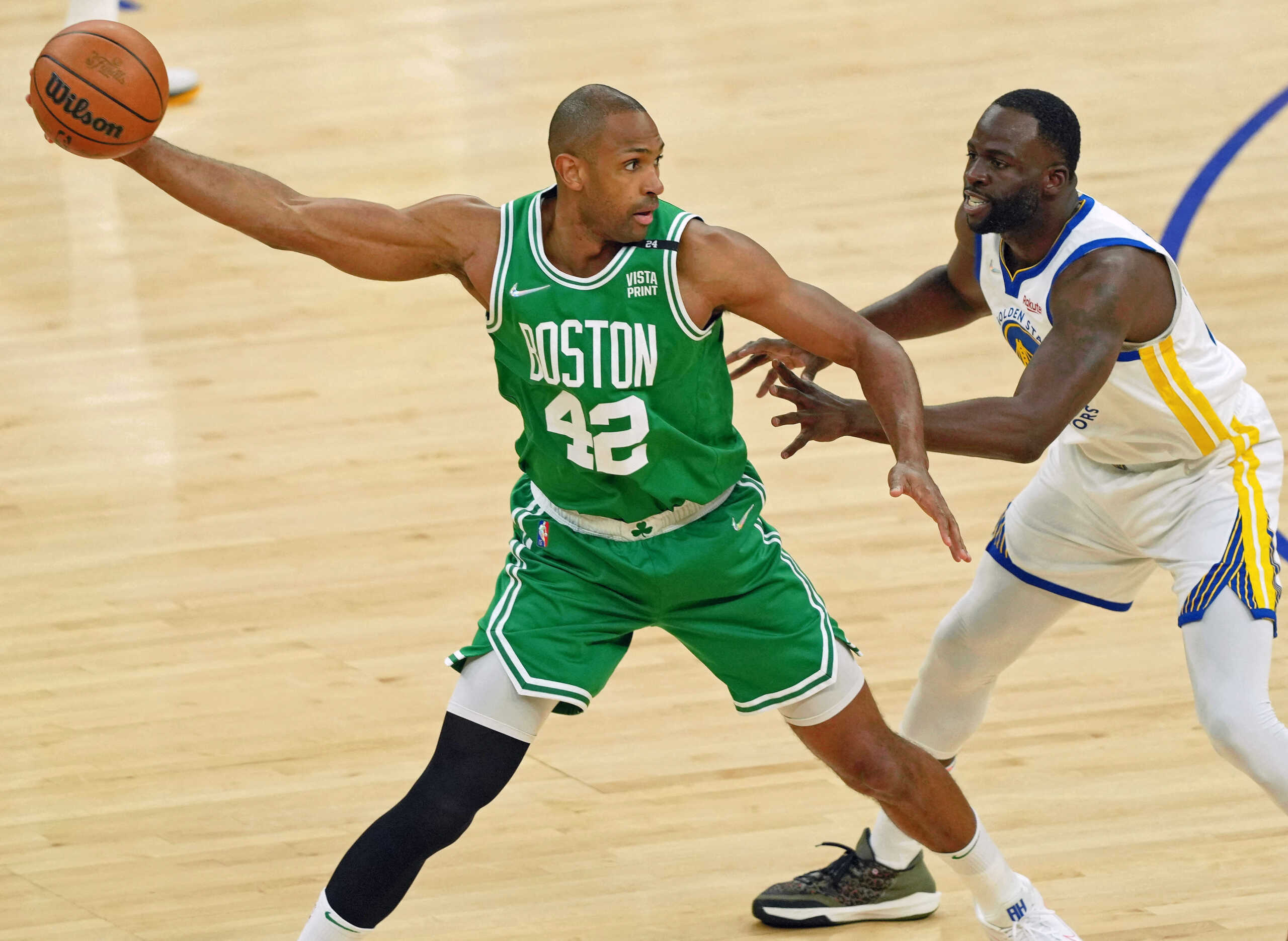 Jun 2, 2022; San Francisco, California, USA; Boston Celtics center Al Horford (42) controls the ball while defended by Golden State Warriors forward Draymond Green (23) during the first half of game one of the 2022 NBA Finals at Chase Center. Mandatory Credit: Darren Yamashita-USA TODAY Sports