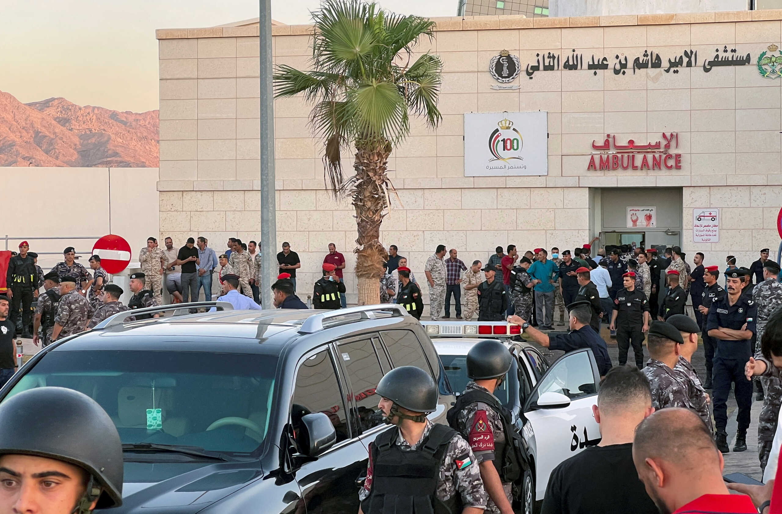 Members of the Jordanian Gendarmerie stand outside a hospital after toxic gas leak from a storage tank in Jordan's Aqaba port, Jordan June 27, 2022. REUTERS