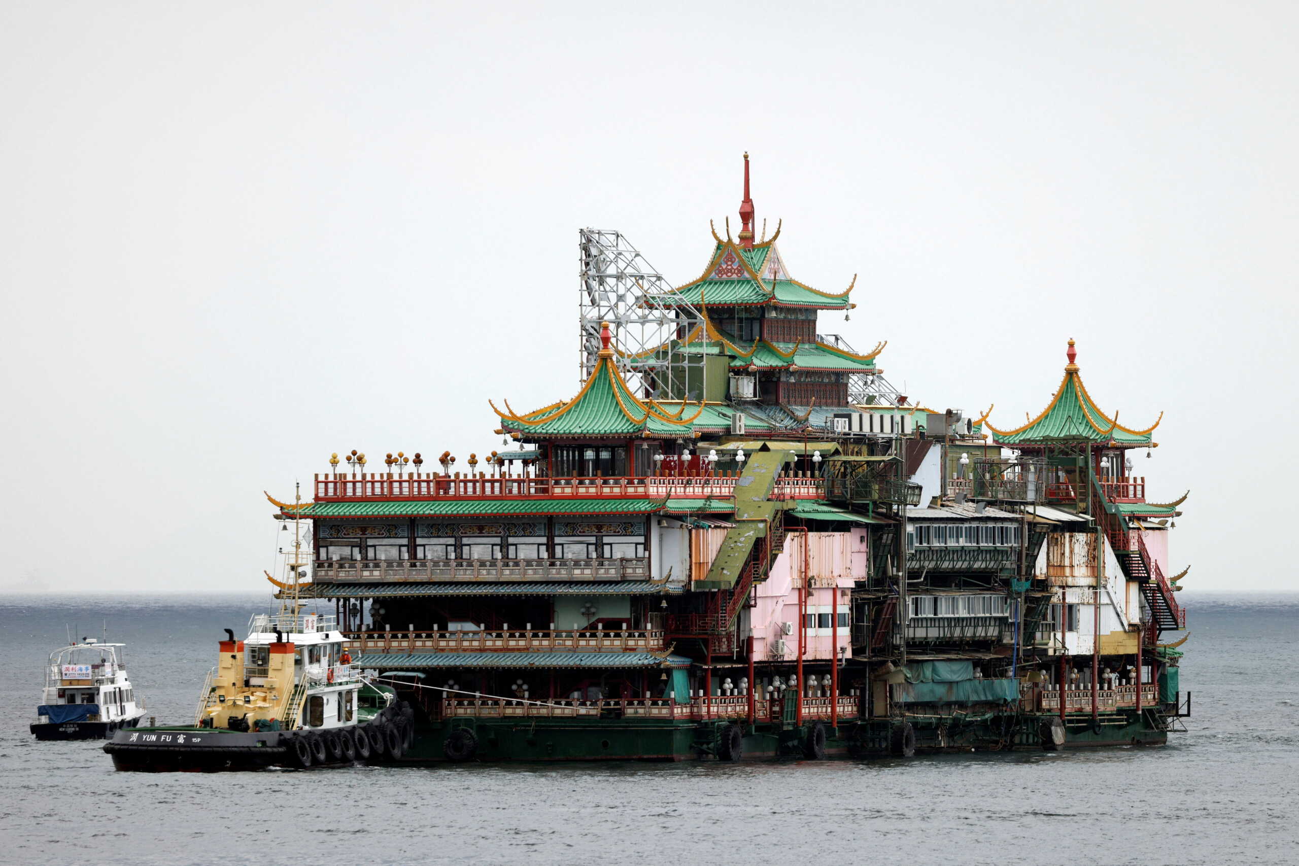 Closed iconic Jumbo Floating Restaurant sails away after the operator announced it would leave Hong Kong because of a lack of funds for maintenance, in Hong Kong, China, June 14, 2022. REUTERS