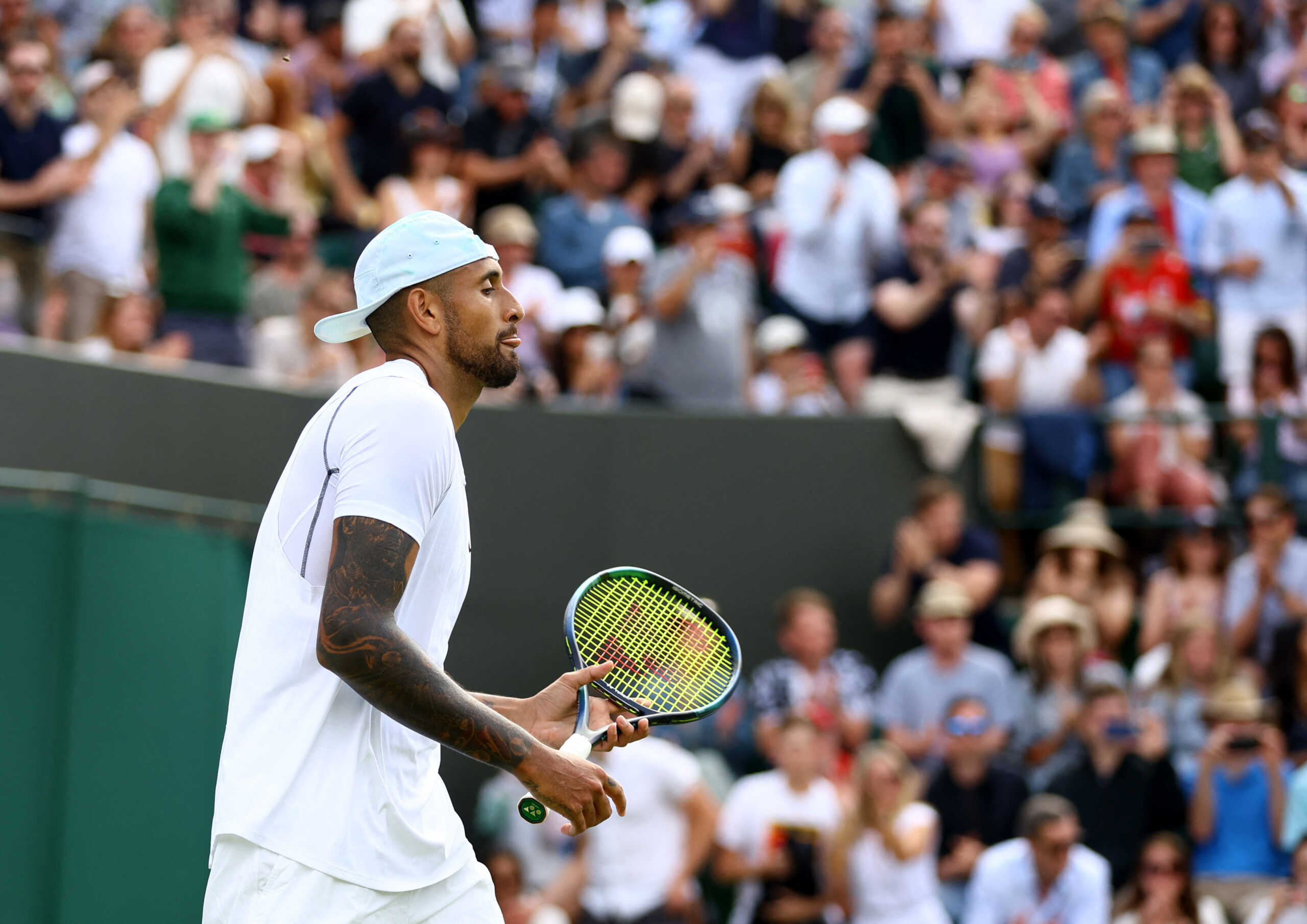 Tennis - Wimbledon - All England Lawn Tennis and Croquet Club, London, Britain - June 28, 2022 Australia's Nick Kyrgios reacts during his first round match against Britain's Paul Jubb REUTERS