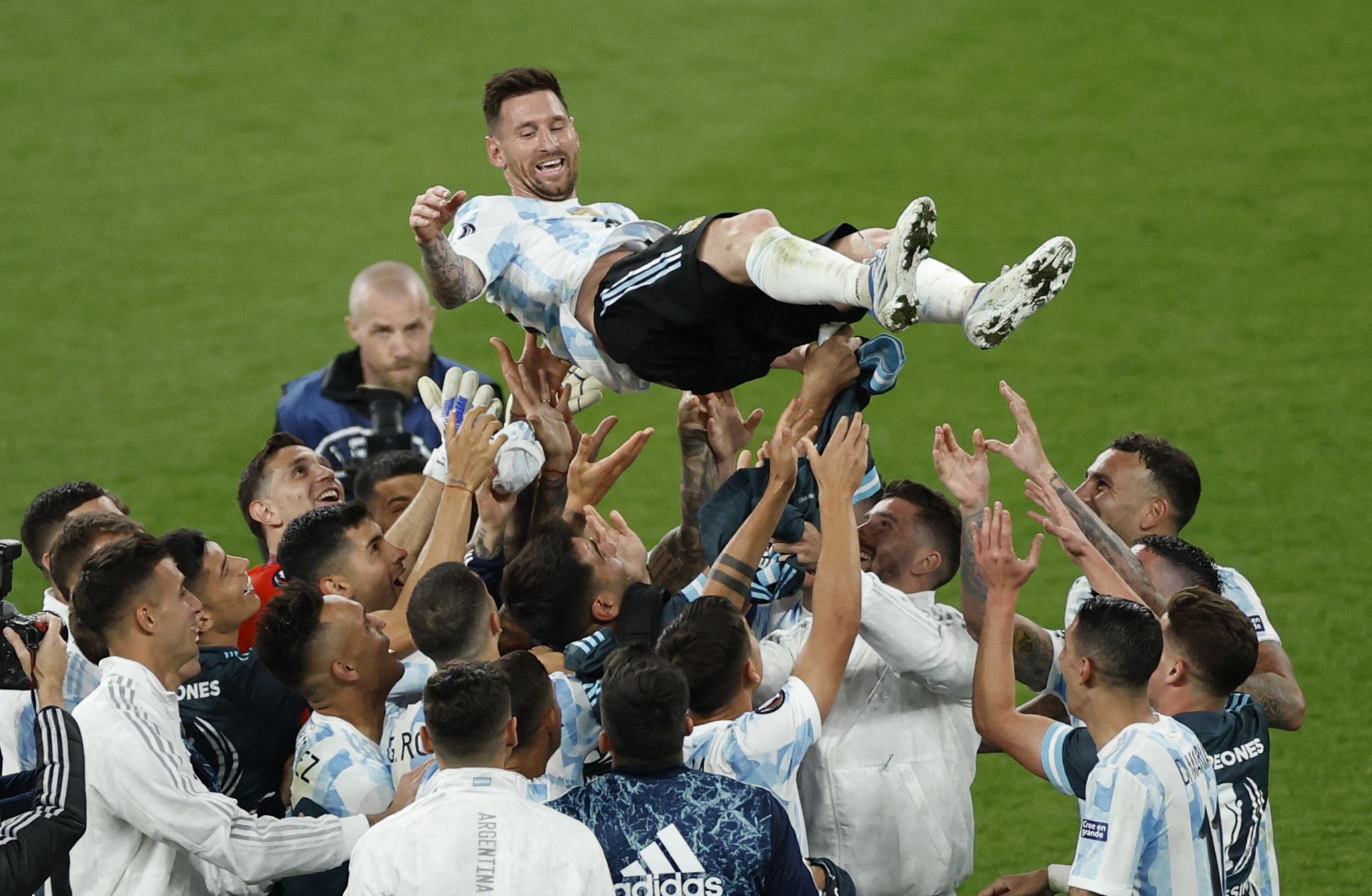 Soccer Football - Finalissima - Italy v Argentina - Wembley Stadium, London, Britain - June 1, 2022 Argentina's Lionel Messi is toosed by with teammates REUTERS