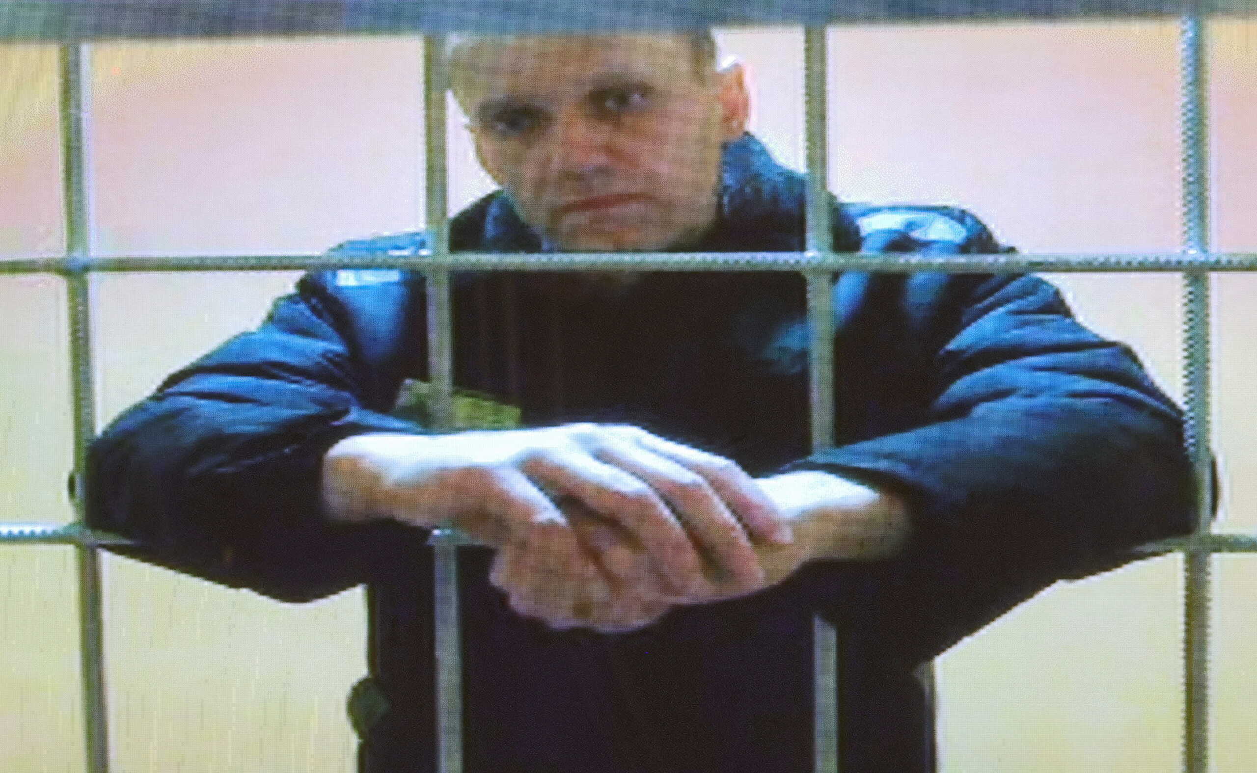 Russian opposition leader Alexei Navalny is seen on a screen via a video link from the IK-2 corrective penal colony in Pokrov during a court hearing to consider an appeal against his prison sentence in Moscow, Russia May 24, 2022. REUTERS