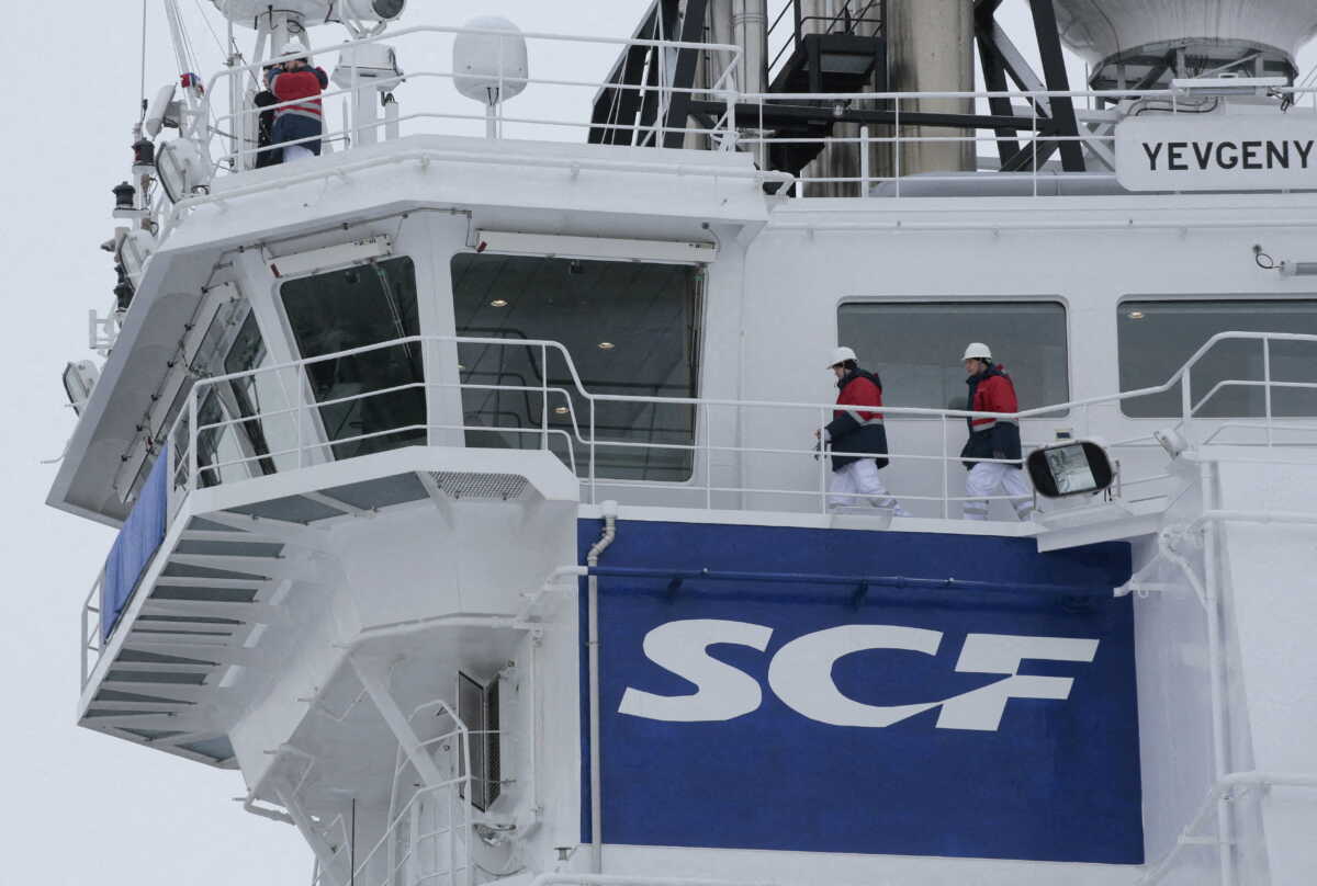 FILE PHOTO: The logo of Russian state shipping company Sovcomflot is seen on the multifunctional icebreaking standby vessel "Yevgeny Primakov" moored in central St. Petersburg, Russia February 3, 2018. REUTERS