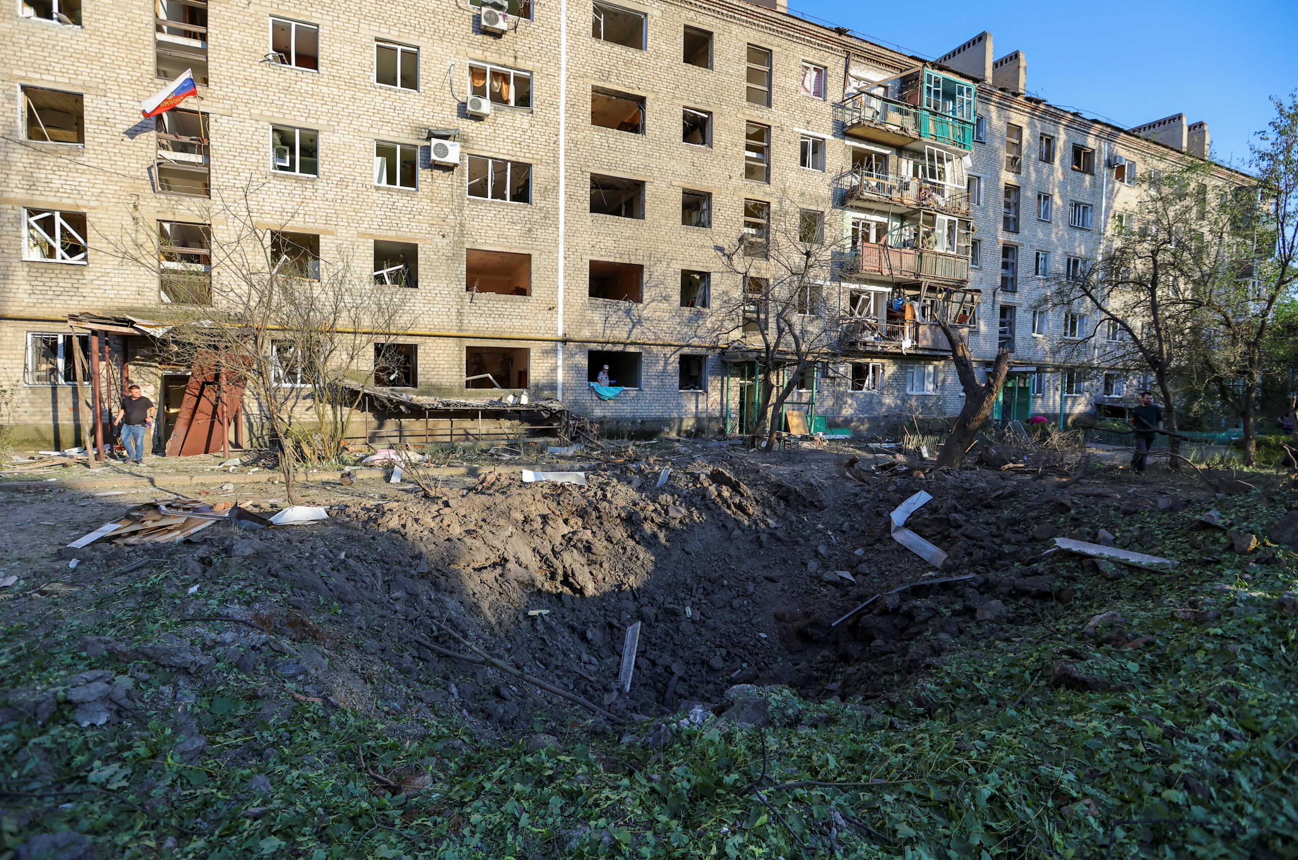 A view shows a crater in the courtyard of a residential building located in Vannikova street following recent shelling in the course of Ukraine-Russia conflict in Donetsk, Ukraine June 20, 2022. REUTERS