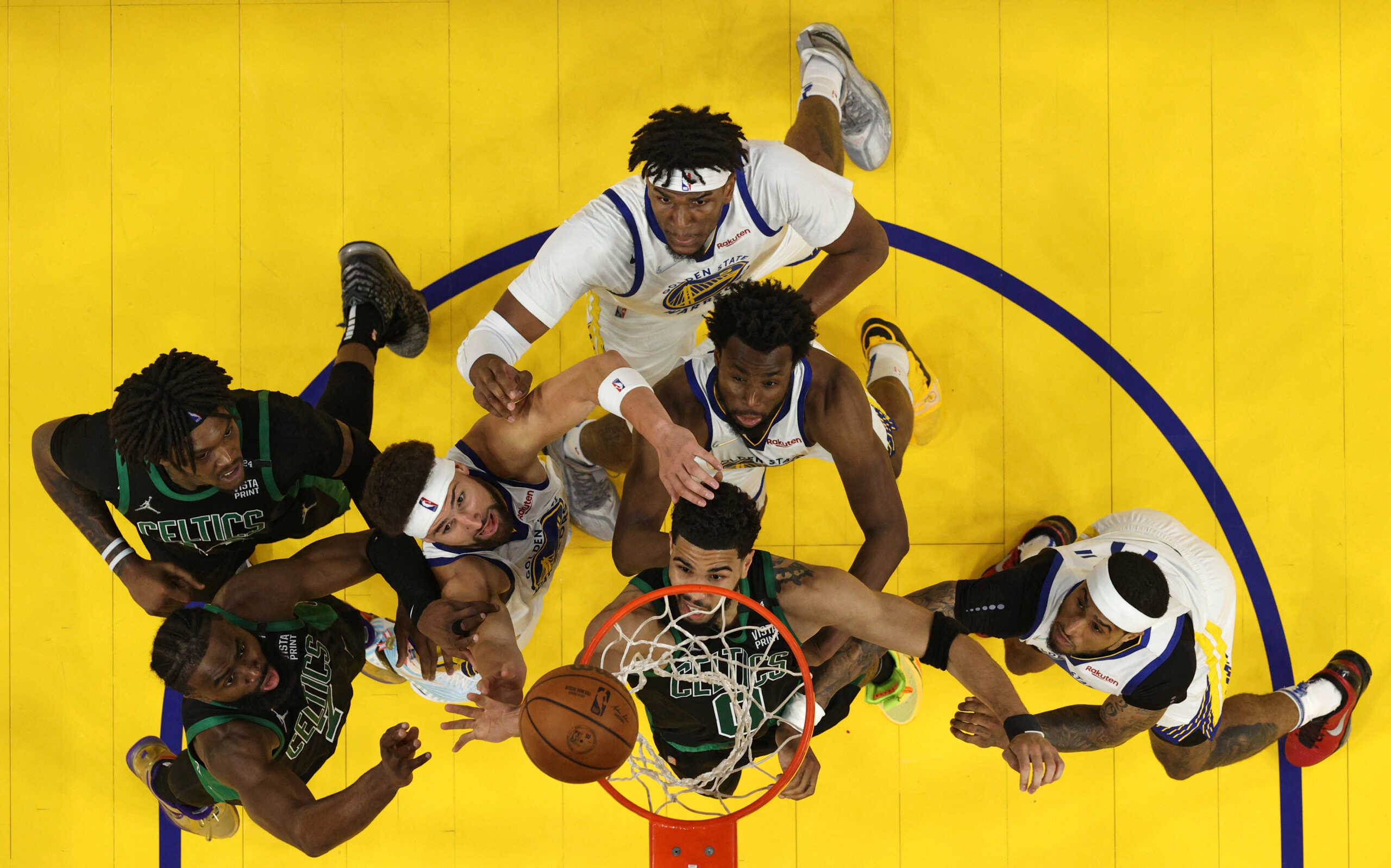 Jun 13, 2022; San Francisco, California, USA; Boston Celtics and Golden State Warriors players battle for a rebound in game five of the 2022 NBA Finals at Chase Center. Mandatory Credit: Ezra Shaw