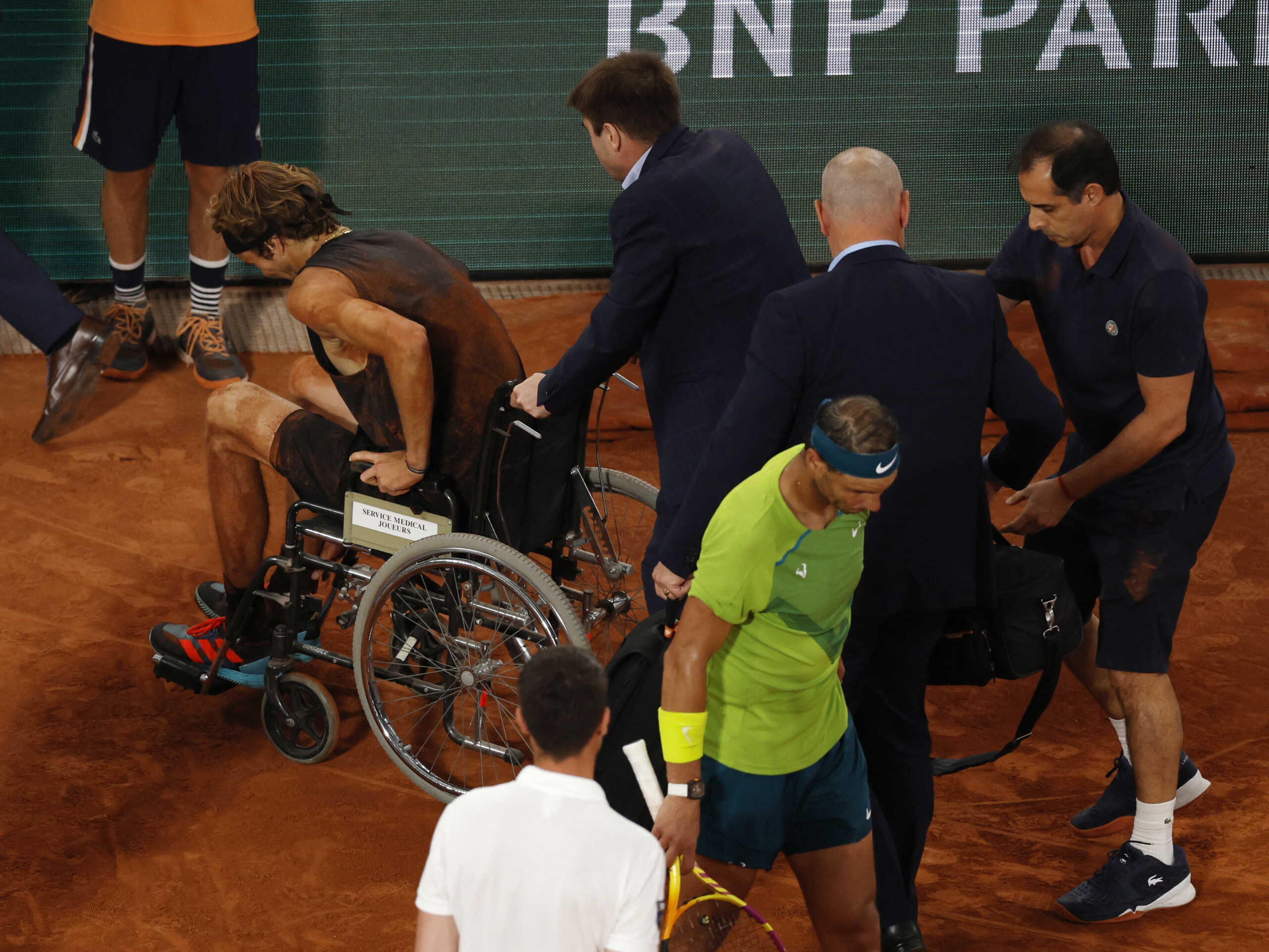 Tennis - French Open - Roland Garros, Paris, France - June 3, 2022 Germany's Alexander Zverev leaves the court after sustaining an injury REUTERS