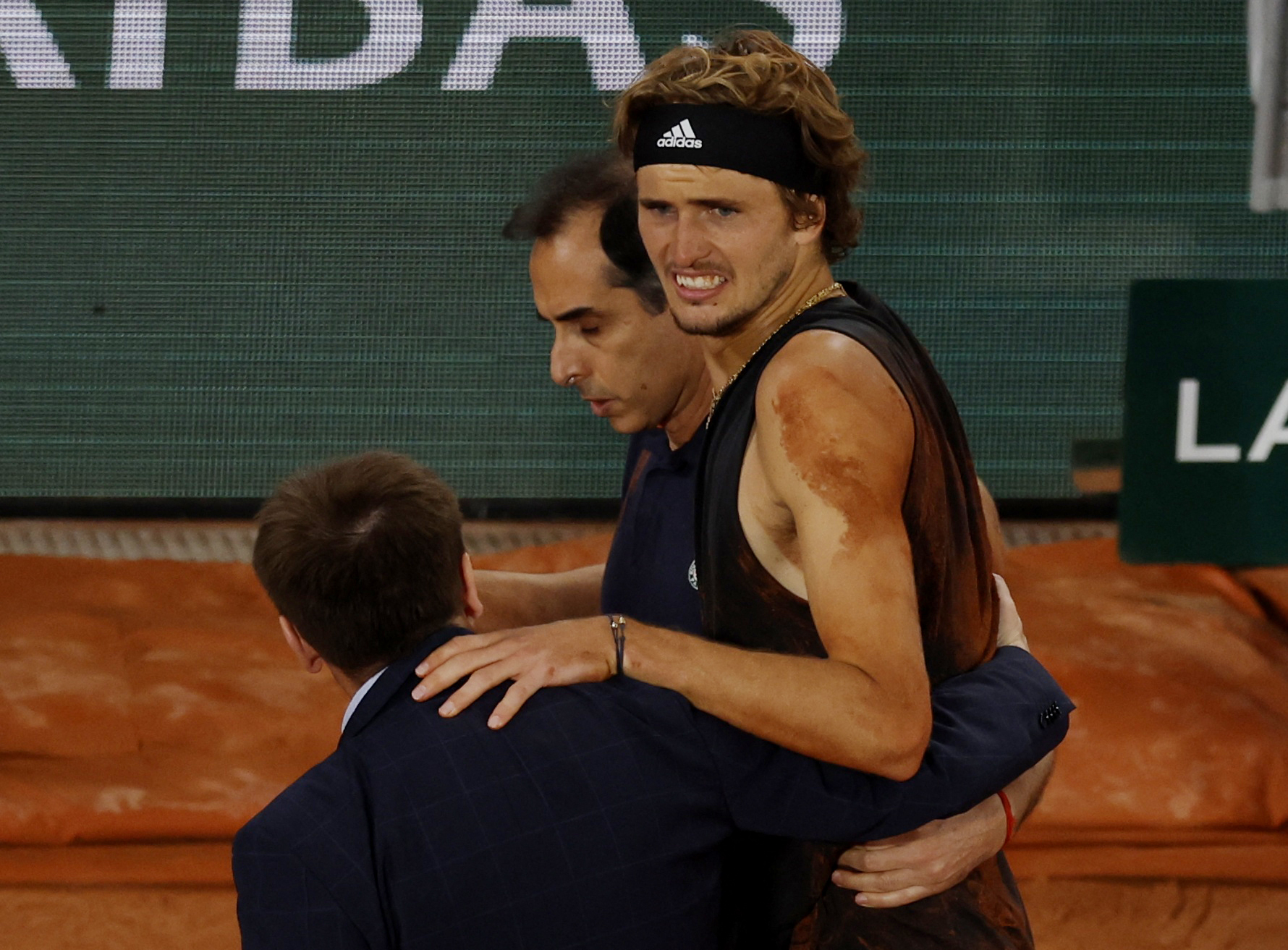 Tennis - French Open - Roland Garros, Paris, France - June 3, 2022 Germany's Alexander Zverev receives medical attention after sustaining an injury REUTERS