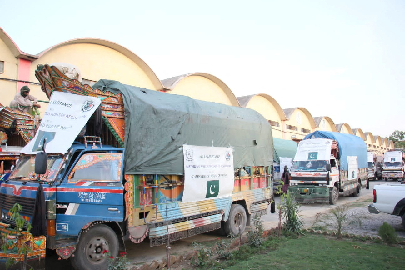 Trucks loaded with supplies of tents, tarpaulins, blankets, and emergency medicines for the earthquake affected people of Afghanistan, from the people and government of Pakistan, wait to leave from Islamabad, Pakistan June 22, 2022. Picture taken June 22, 2022. National Disaster Management Authority (NDMA)