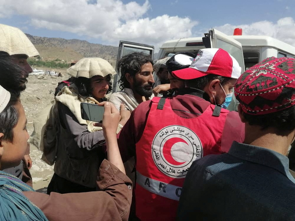Afghan Red Crescent medics and volunteers transport earthquake victims to hospitals in Spera district, Khost province, Afghanistan, June 22, 2022. Afghan Red Crescent Society