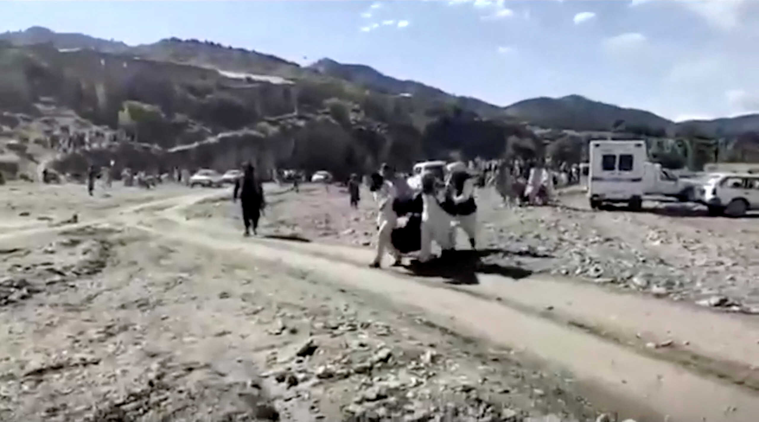 People carry injured to be evacuated following a massive earthquake, in Paktika Province, Afghanistan, June 22, 2022, in this screen grab taken from a video. BAKHTAR NEWS AGENCY