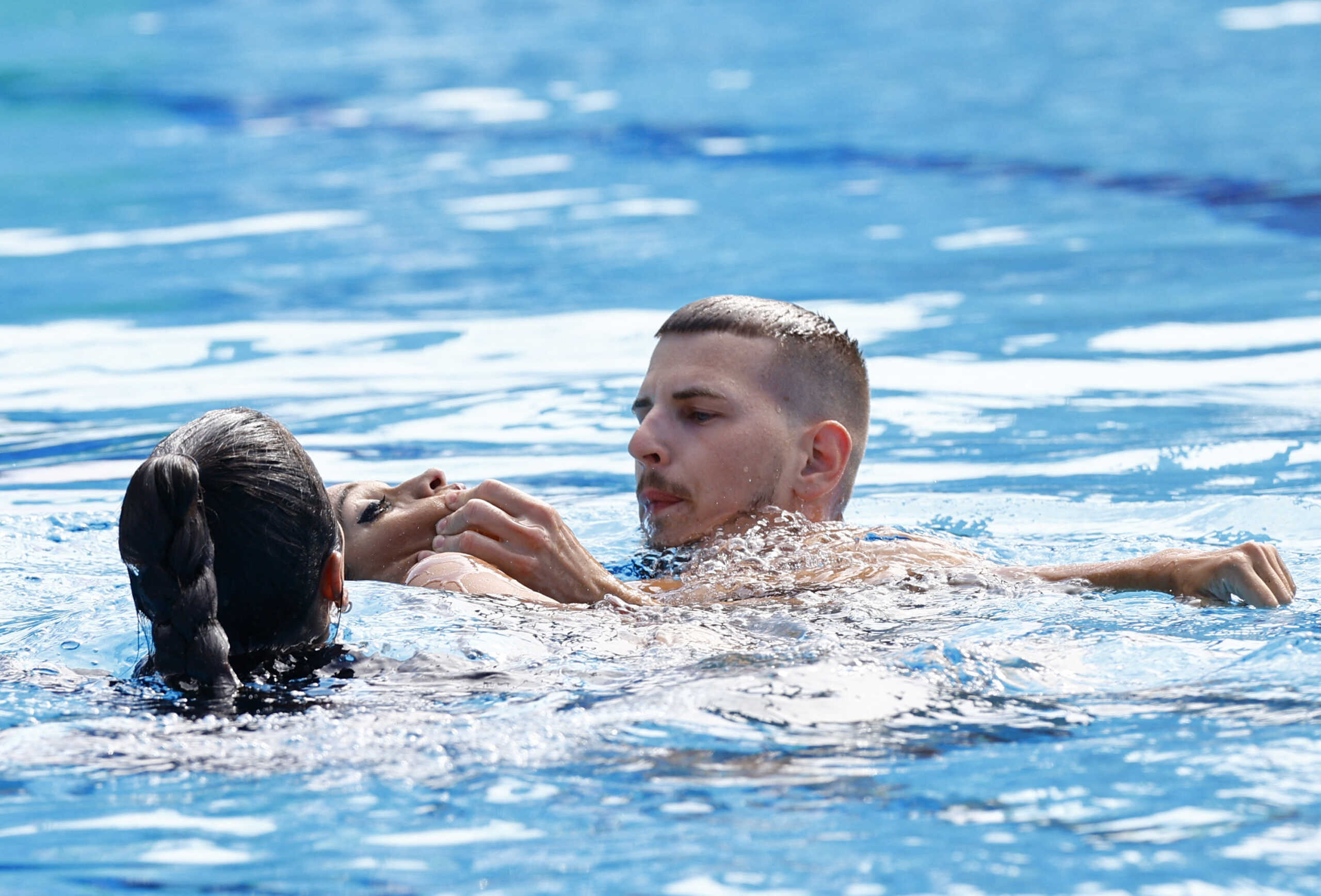 Artistic Swimming - FINA World Championships - Alfred Hajos Swimming Complex, Budapest, Hungary - June 22, 2022  Anita Alvarez of the U.S. receives medical attention during the women's solo free final REUTERS