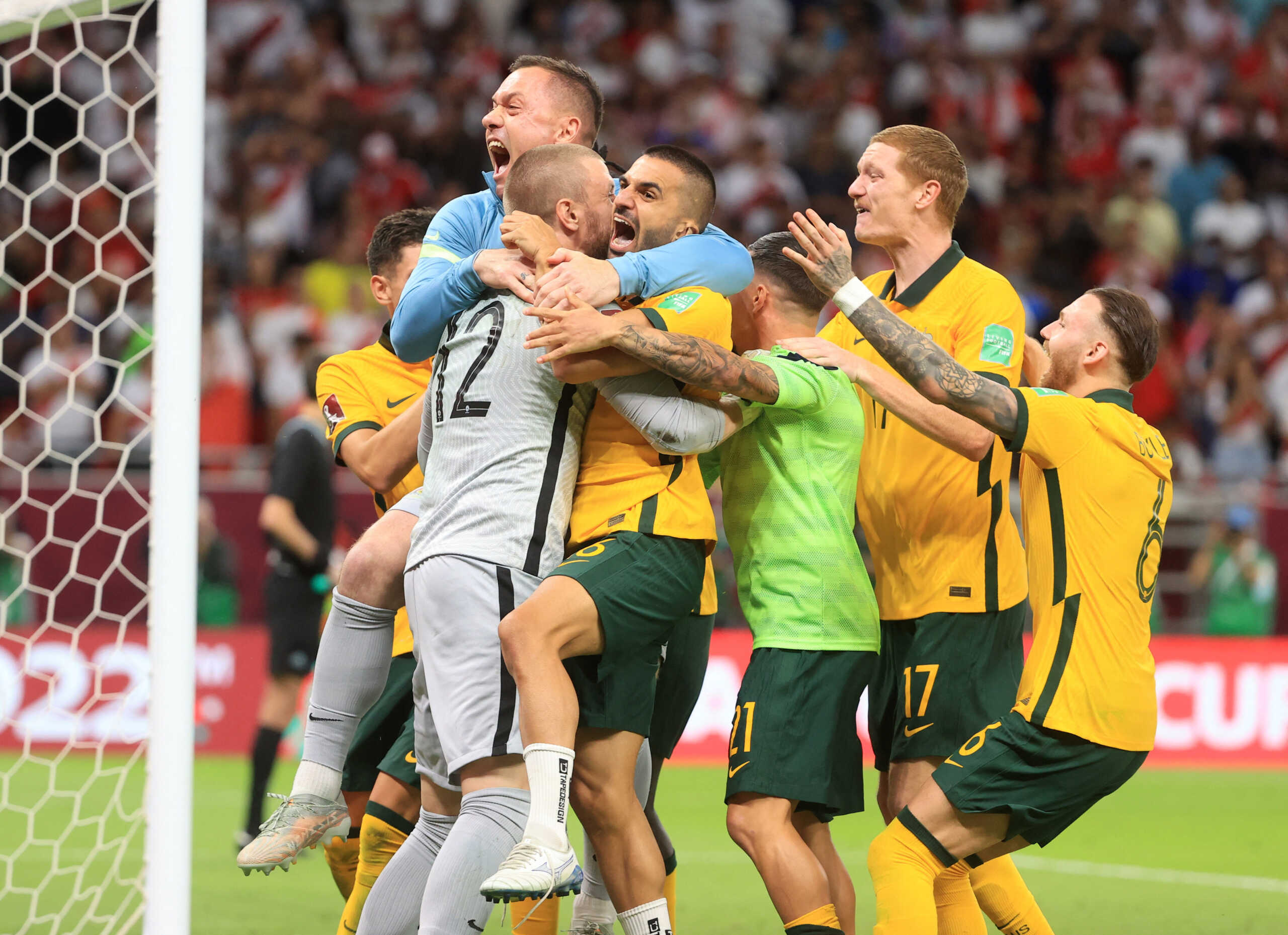Soccer Football - FIFA World Cup Qualifier - Australia v Peru - Al Rayyan Stadium, Al Rayyan, Qatar - June 13, 2022 Australia players celebrate after qualifying to the FIFA World Cup REUTERS