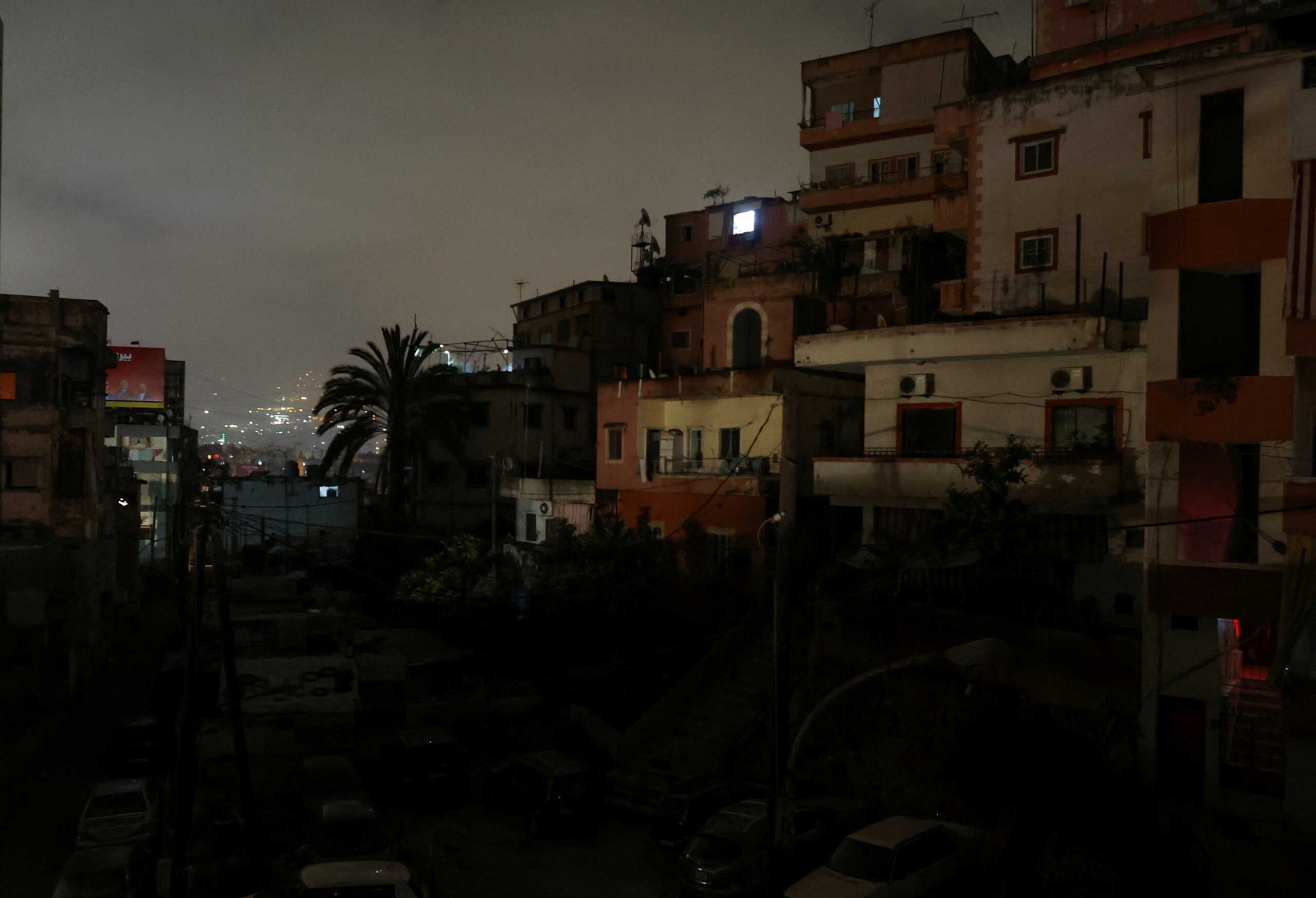 FILE PHOTO: Residential buildings are pictured at night during a power cut in Beirut, Lebanon April 27, 2022.  REUTERS