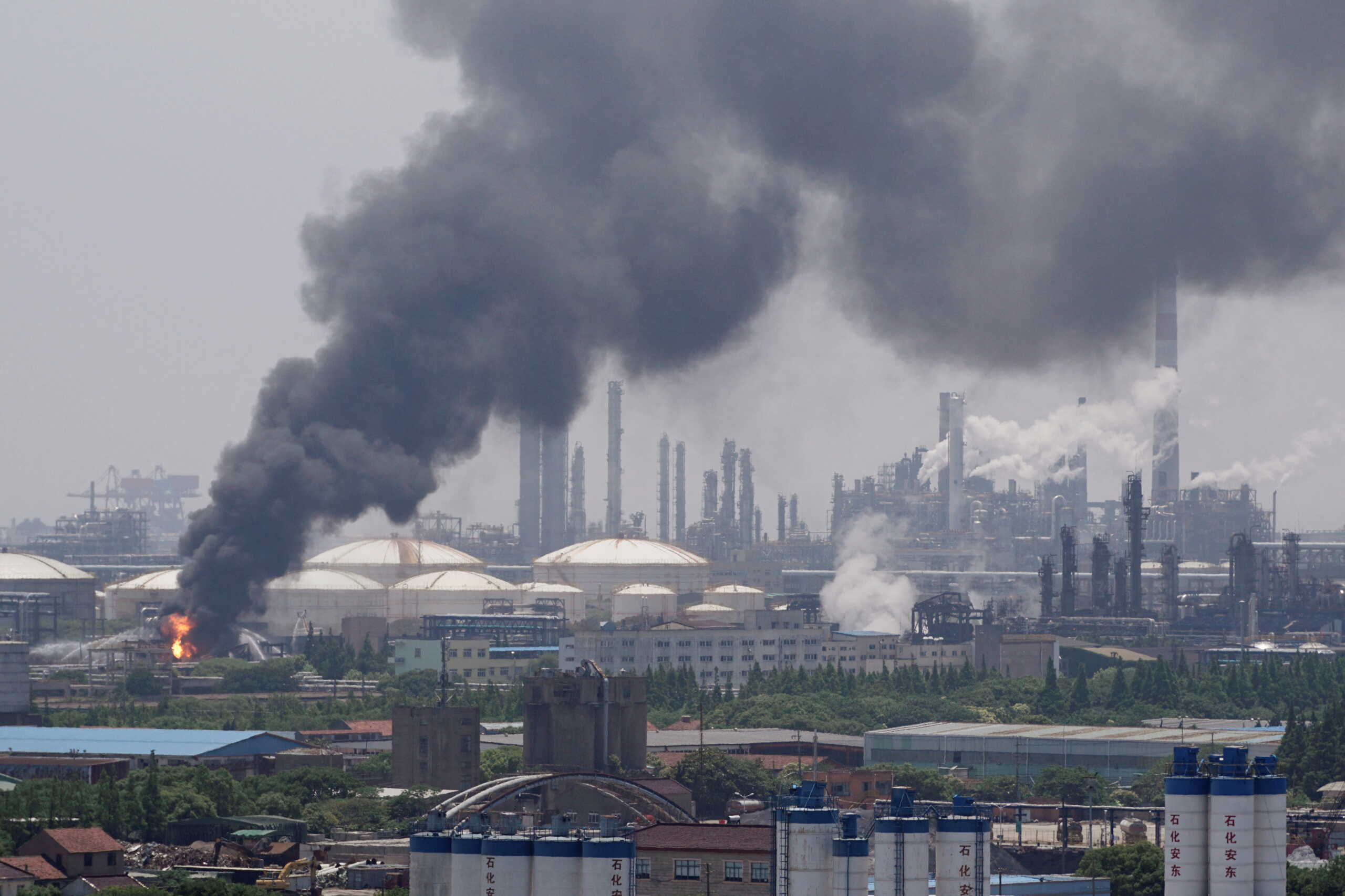 Smoke billows from a Sinopec Shanghai Petrochemical Co Ltd plant where a fire broke out, in Jinshan district of Shanghai, China June 18, 2022. REUTERS
