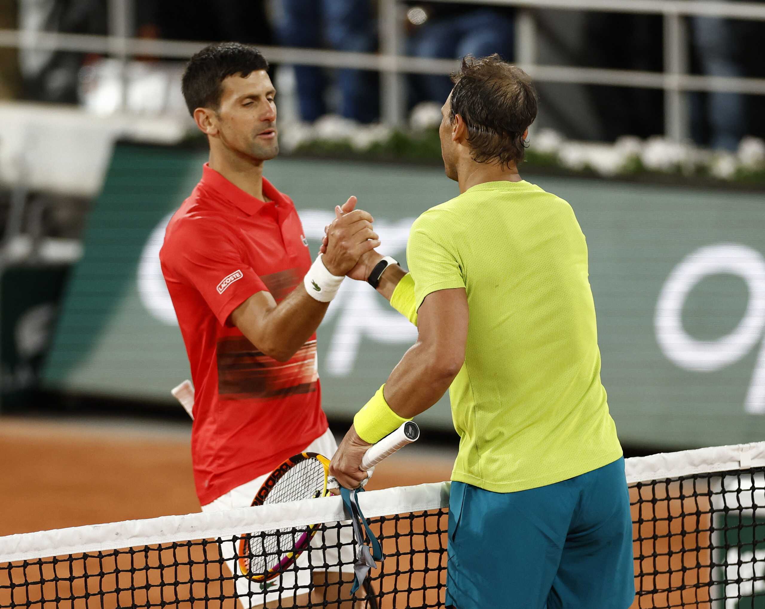 Tennis - French Open - Roland Garros, Paris, France - June 1, 2022  Spain's Rafael Nadal shakes hands with Serbia's Novak Djokovic after winning their quarter final match REUTERS