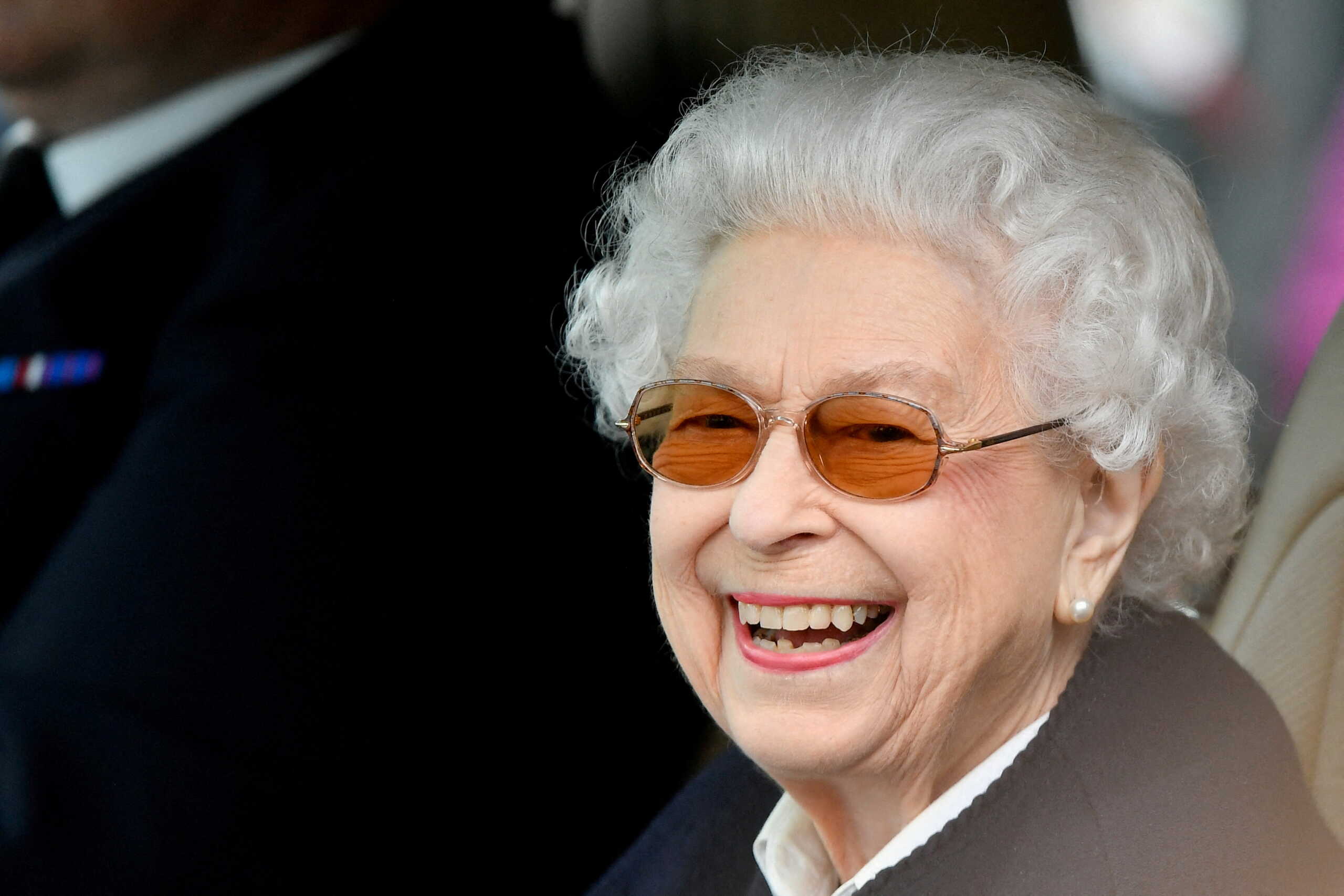 FILE PHOTO: Britain's Queen Elizabeth reacts as she watches horses competing on the second day of the Royal Windsor Horse Show and Platinum Jubilee Celebration in Windsor, Britain, May 13, 2022. REUTERS