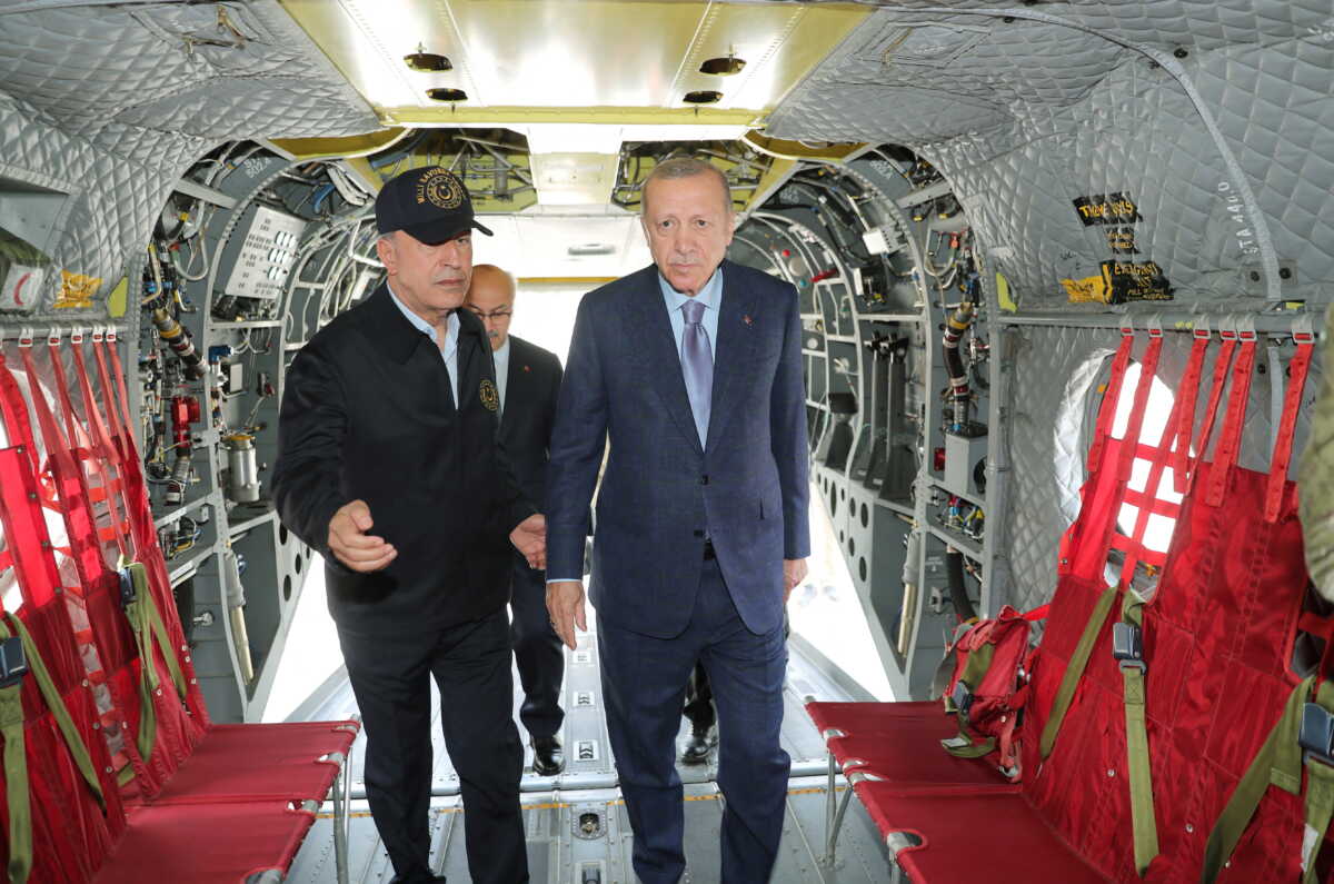 Turkish President Tayyip Erdogan and Defence Minister Hulusi Akar inspect a military vehicle during a military exercise near Izmir, Turkey, June 9, 2022. Murat Cetinmuhurdar