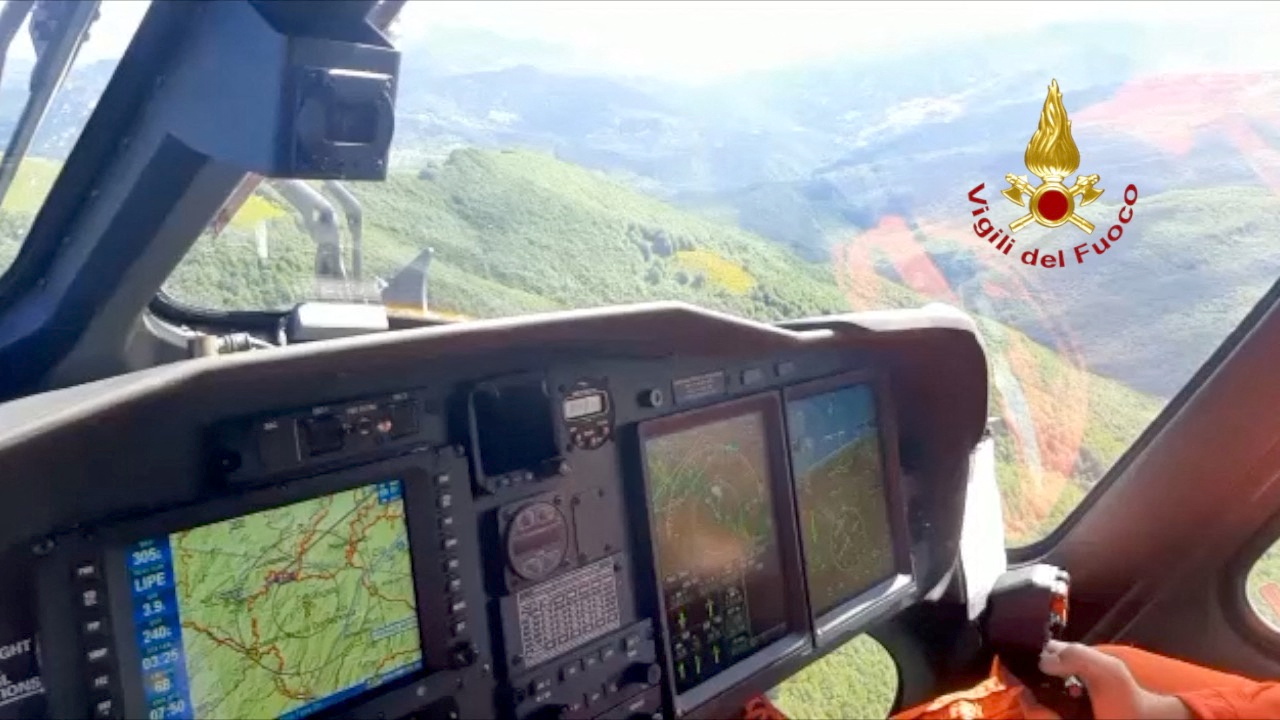 Fire brigade perform a search operation for a helicopter that vanished on Thursday with seven people aboard, including four Turkish businessmen, on the Apennines, Italy, June 10, 2022. Vigili del Fuoco