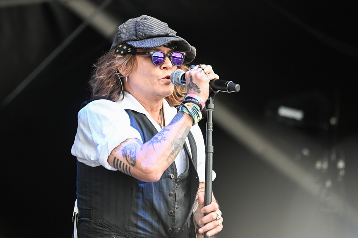 epa10022753 US actor Johnny Depp performs on stage at the Helsinki Blues Festival, Finland, 19 June 2022.  EPA