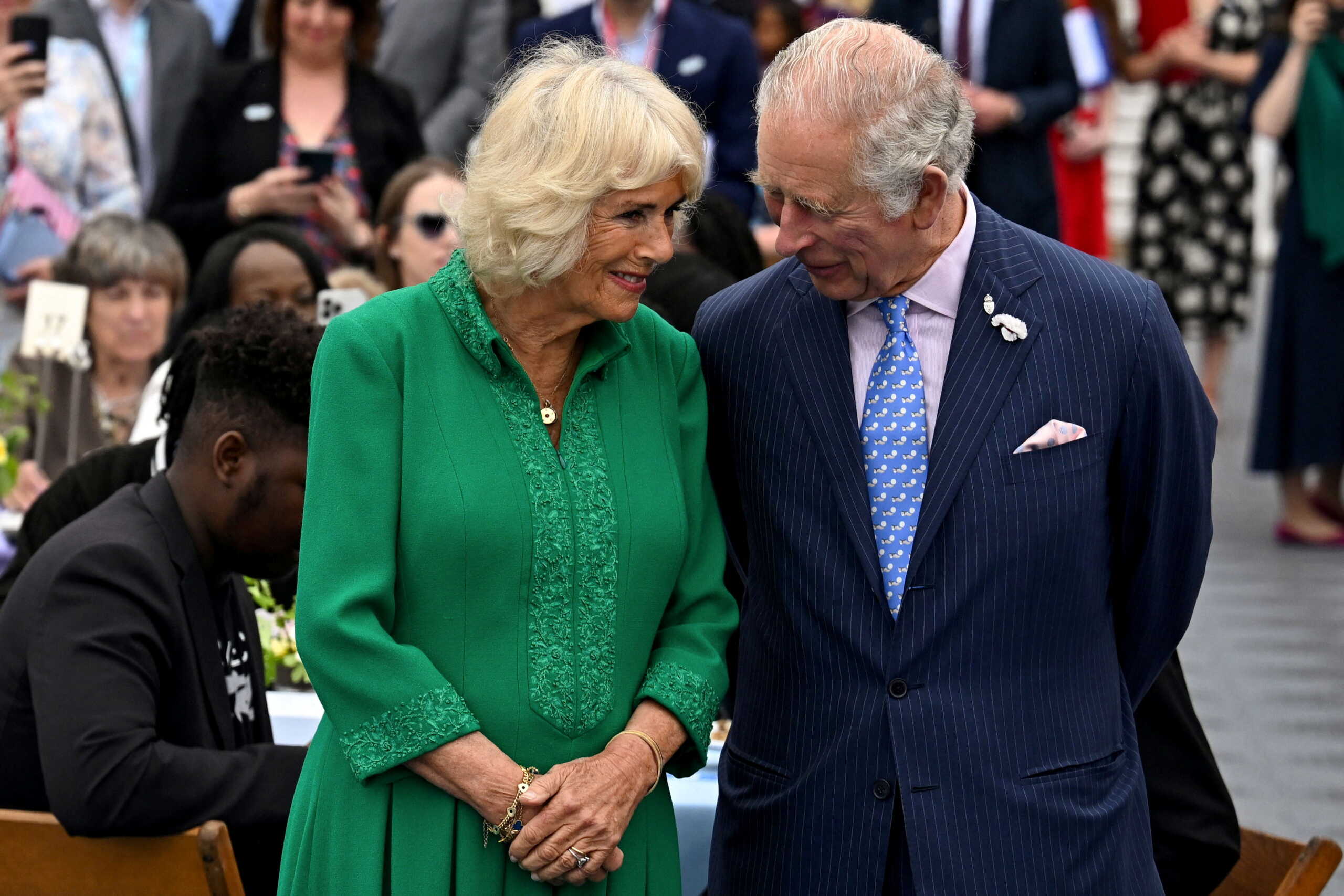 Britain's Prince Charles and his wife Camilla, Duchess of Cornwall, react as they attend a Big Jubilee Lunch at The Oval cricket ground amid celebrations marking the Platinum Jubilee of Britain's Queen Elizabeth, in London, Britain, June 5, 2022. REUTERS