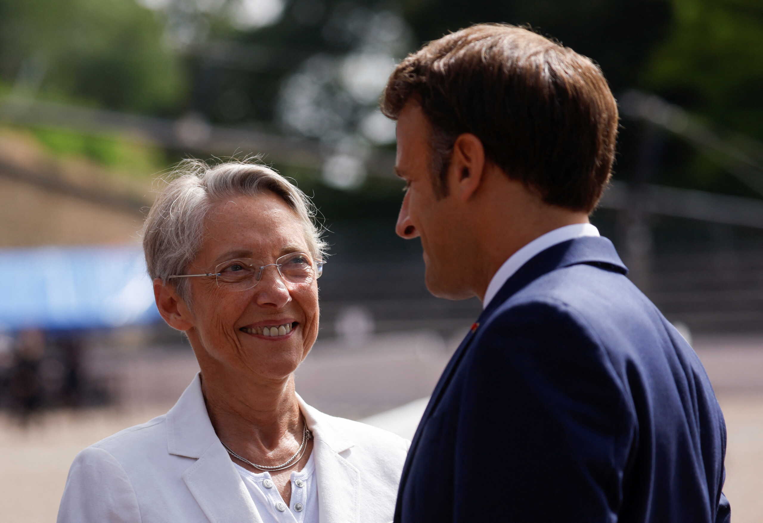 French Prime Minister Elisabeth Borne and President Emmanuel Macron attend a ceremony marking the 82nd anniversary of late French General Charles de Gaulle's resistance call of June 18, 1940, at the Mont Valerien memorial in Suresnes near Paris, France, June 18, 2022. REUTERS