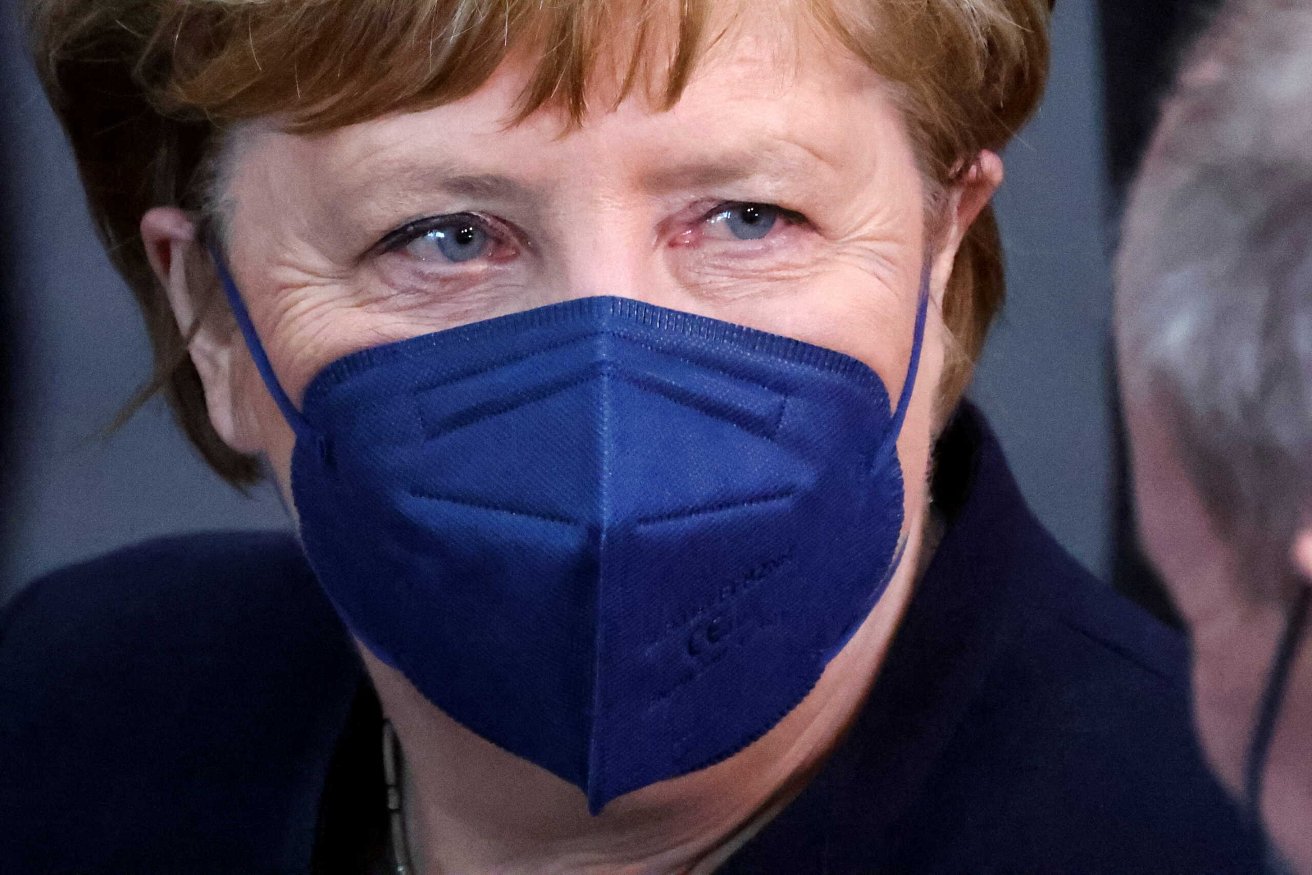 FILE PHOTO: Former Chancellor Angela Merkel looks on at the Bundestag building Paul Loebe Haus, as the Federal Assembly gathers to elect the new German state president, in Berlin, Germany February 13, 2022. REUTERS