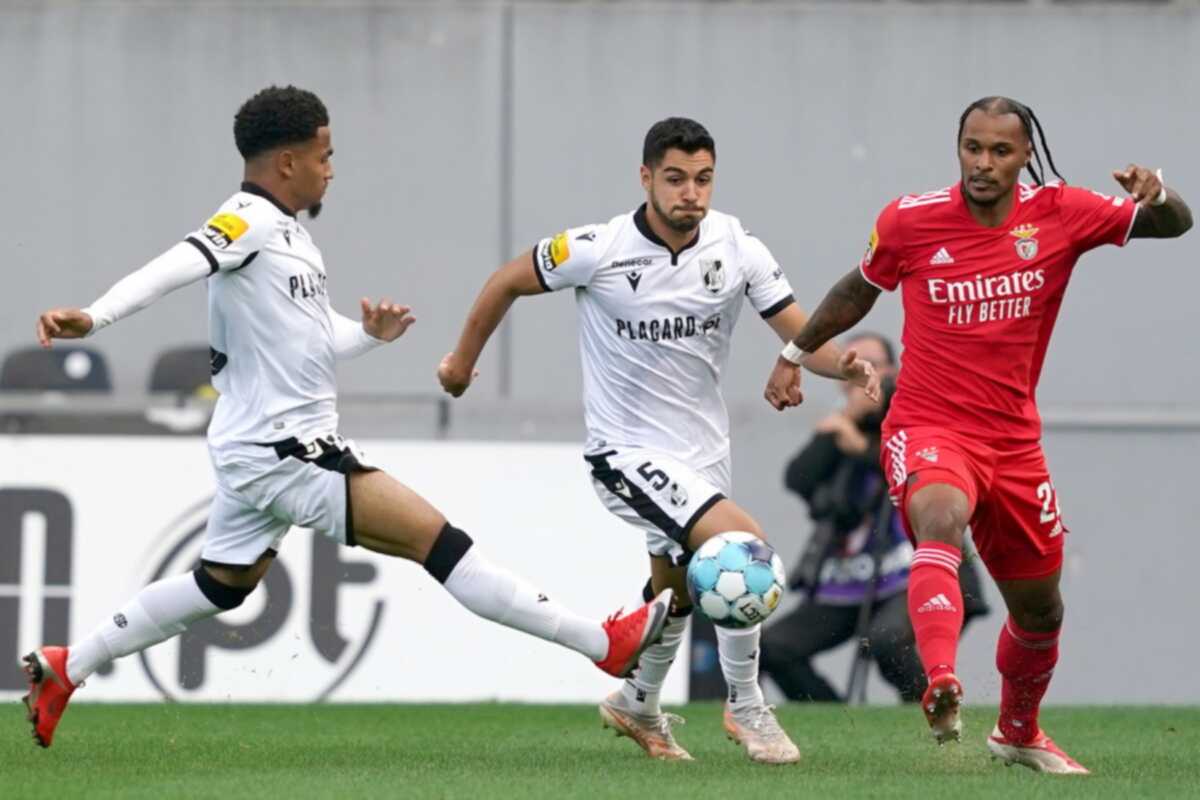 epa09488007 Vitoria de Guimaraes's Rafa Soares (L) in action against Benfica's Valentino Lazaro (R) during the Portuguese First League soccer match between Vitoria de Guimaraes and Benfica held at D. Afonso Henriques stadium in Guimaraes, Portugal, 25 September 2021.  EPA