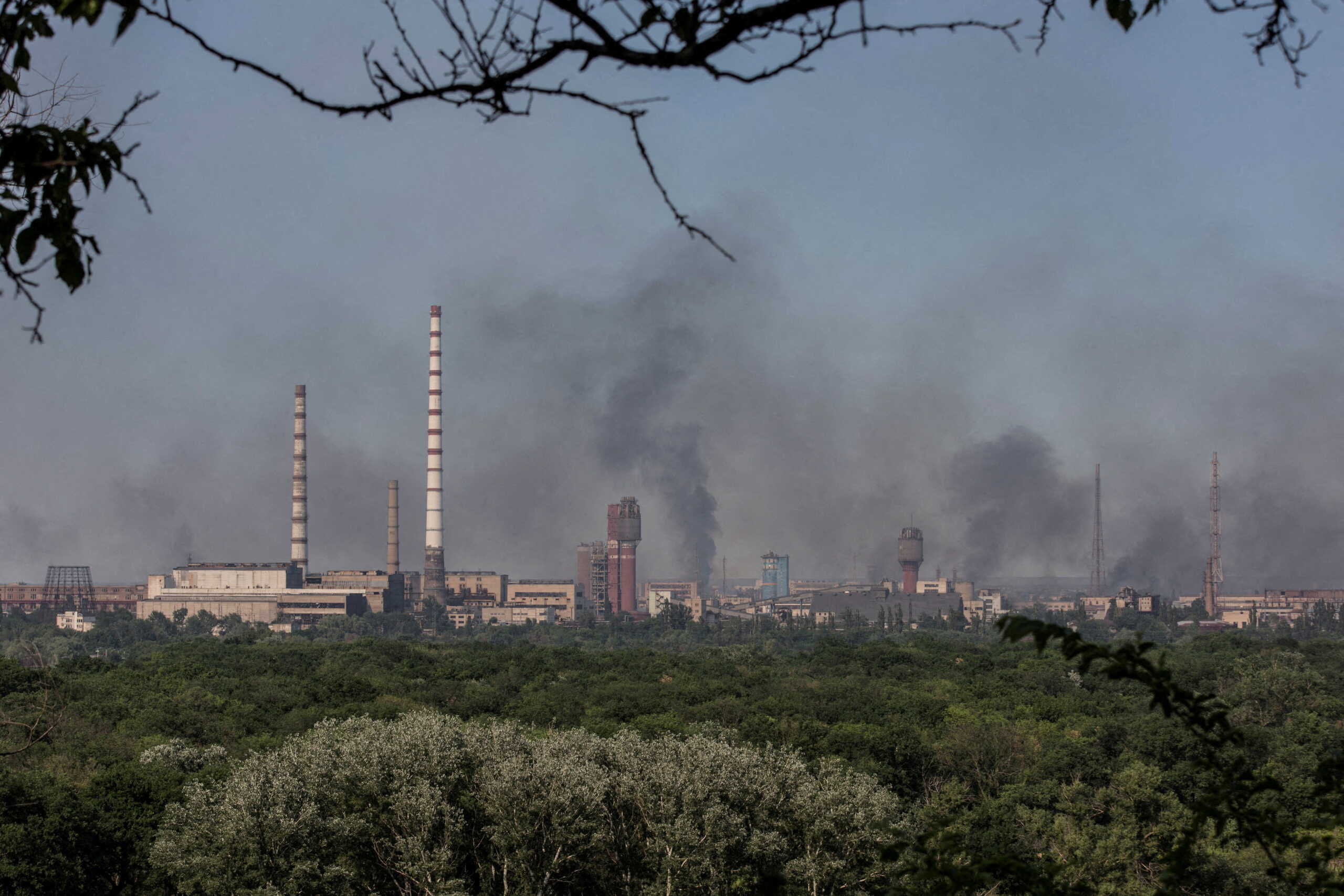 FILE PHOTO: Smoke rises after a military strike on a compound of Sievierodonetsk's Azot Chemical Plant, amid Russia's attack on Ukraine, Lysychansk, Luhansk region, Ukraine June 10, 2022. Picture taken June 10, 2022. REUTERS