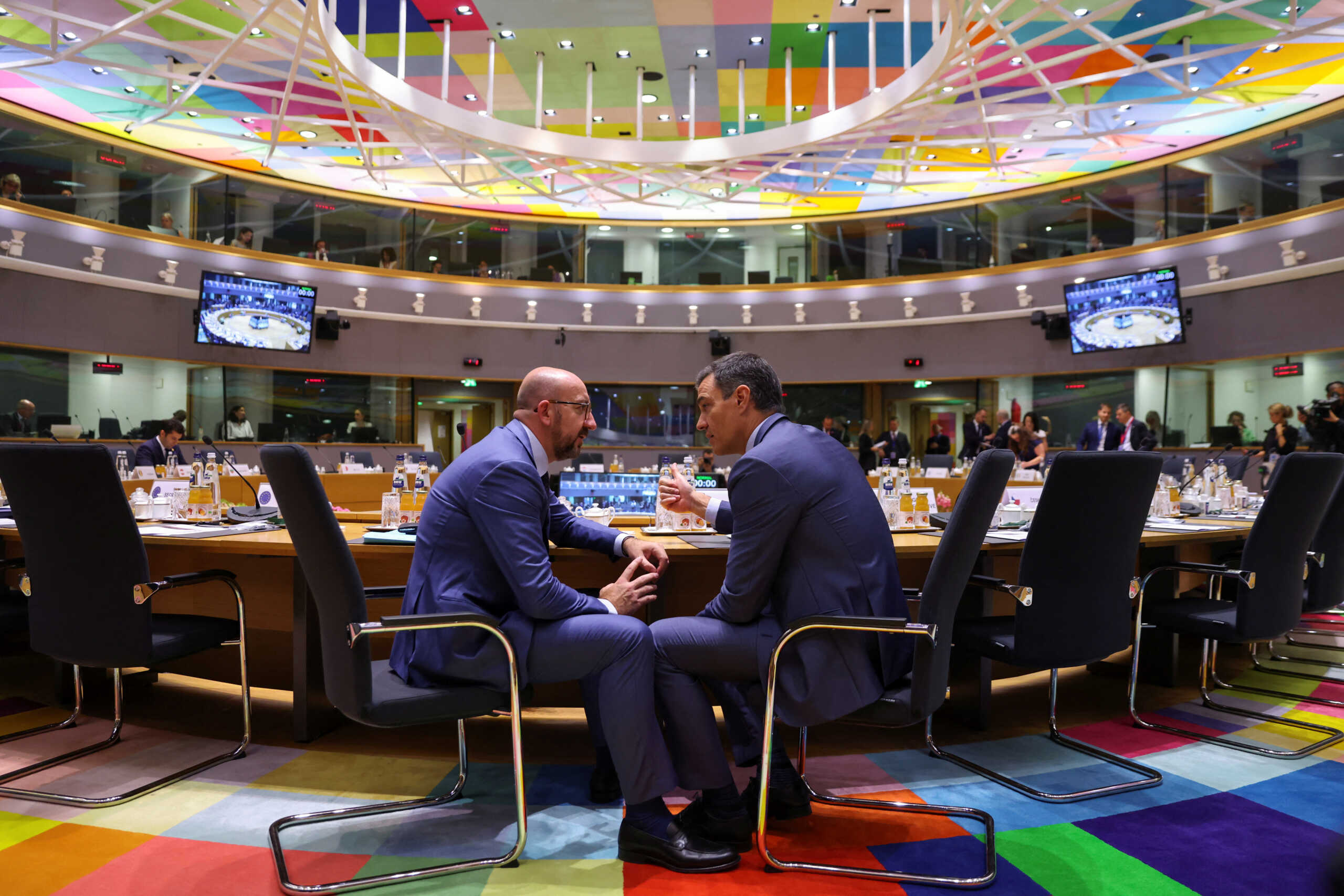 President of the European Council Charles Michel speaks with Spain's Prime Minister Pedro Sanchez at a main meeting room ahead of European Union leaders summit in Brussels, Belgium June 23, 2022. REUTERS
